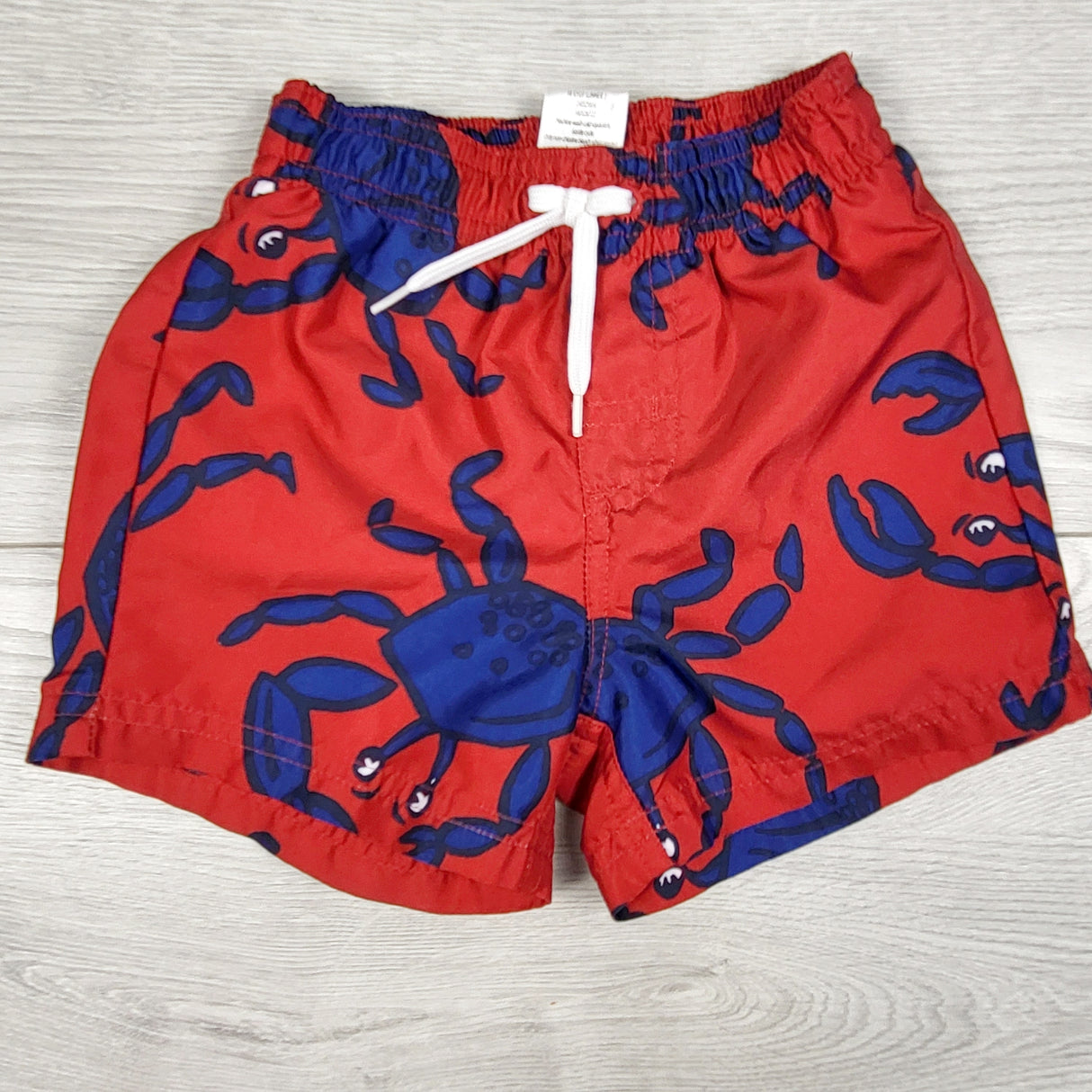 Gymboree red swim shorts with crabs. Size 6-12 months