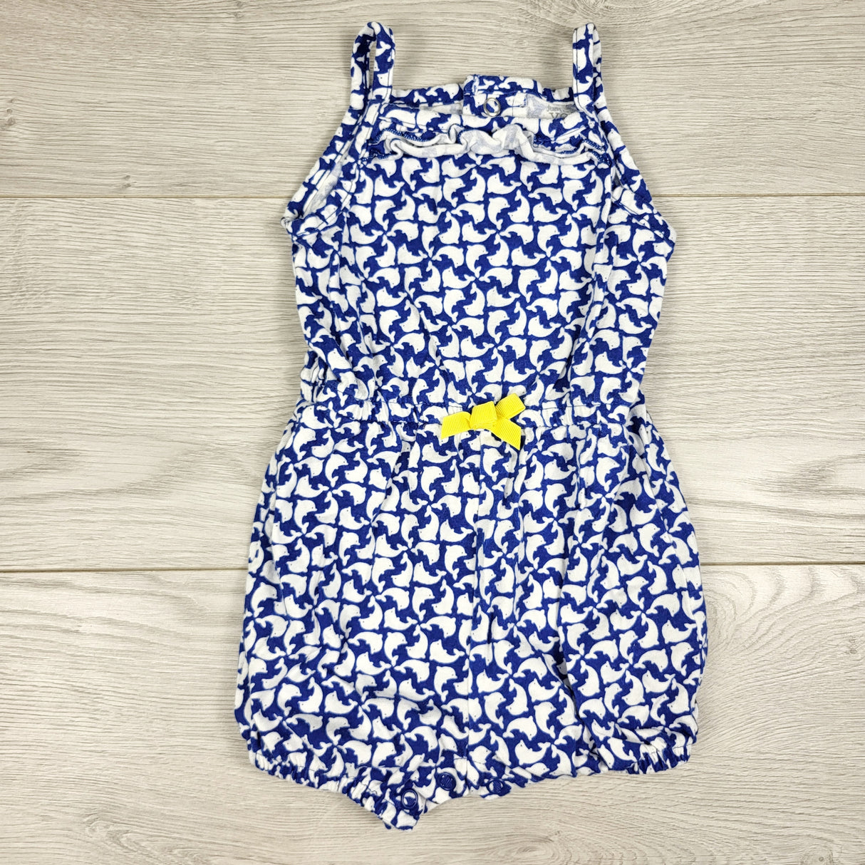 Just One white and blue dolphin patterned romper. Size 9 months