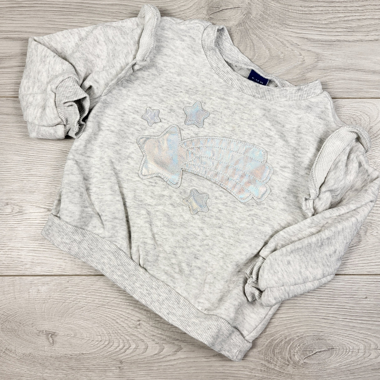 Old Navy grey sweatshirt shimmery shooting star. Size 6-12 months