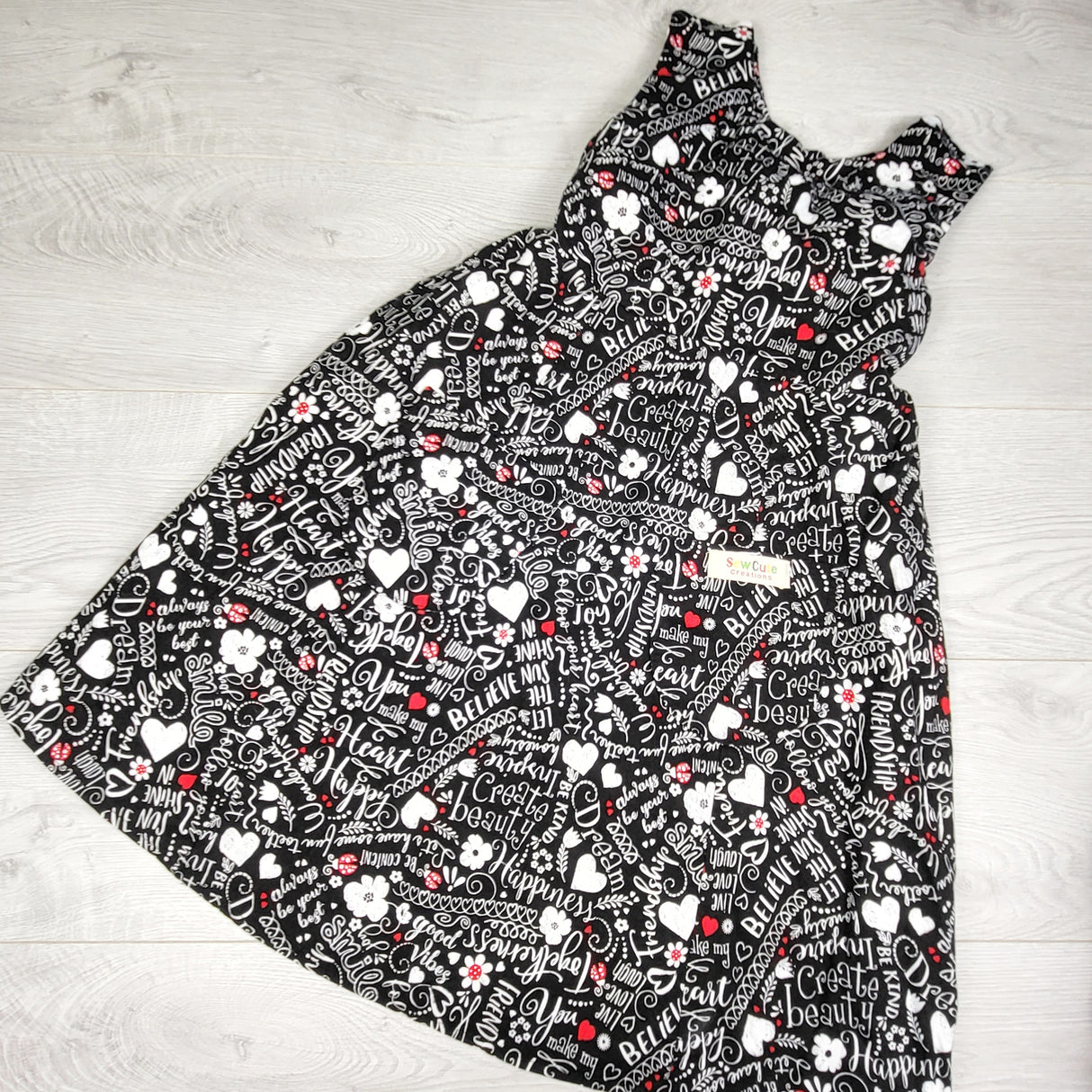 Sew Cute Creations handmade black patterned sleeveless dress. Approx 8-10 Years