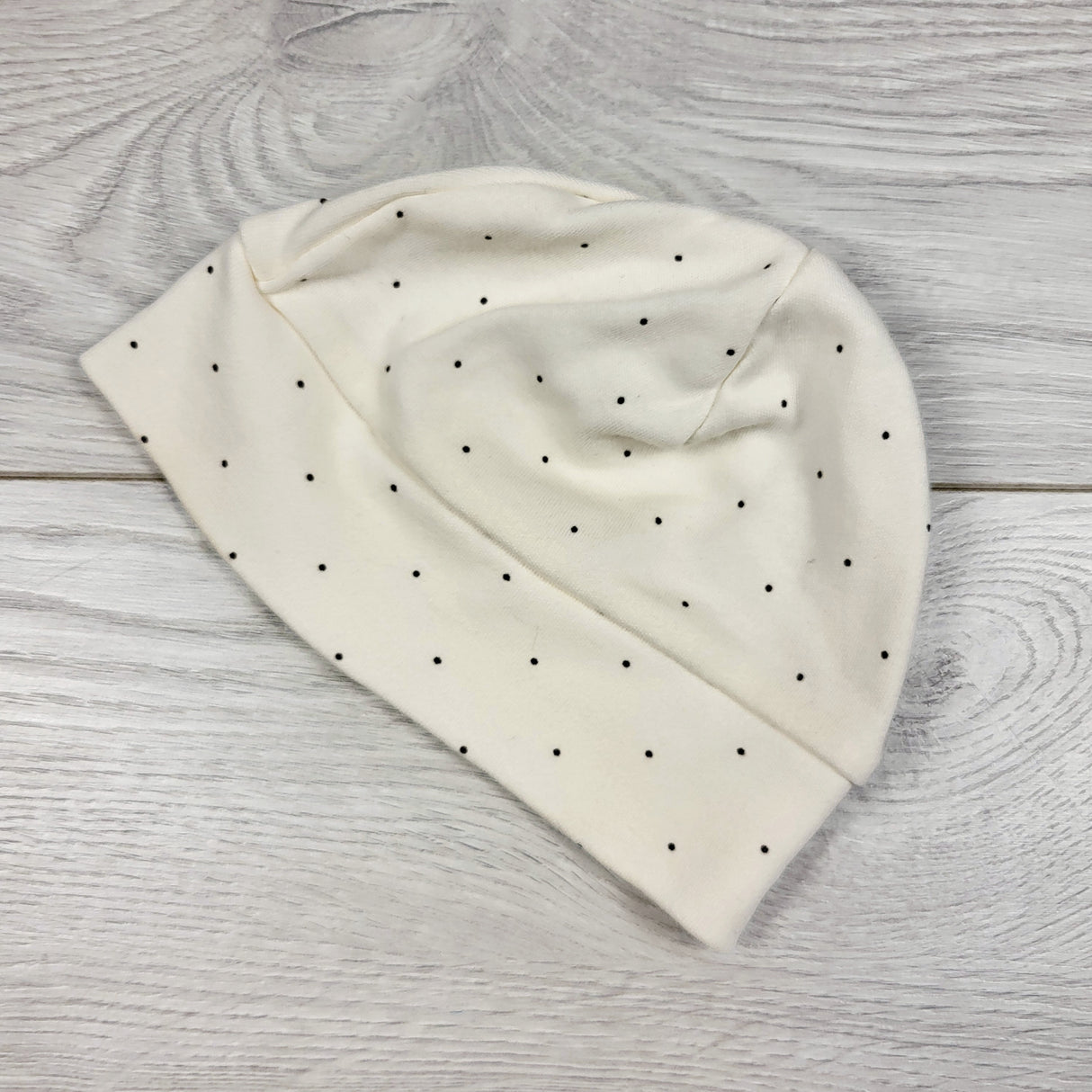 Cream polka dot infant hat