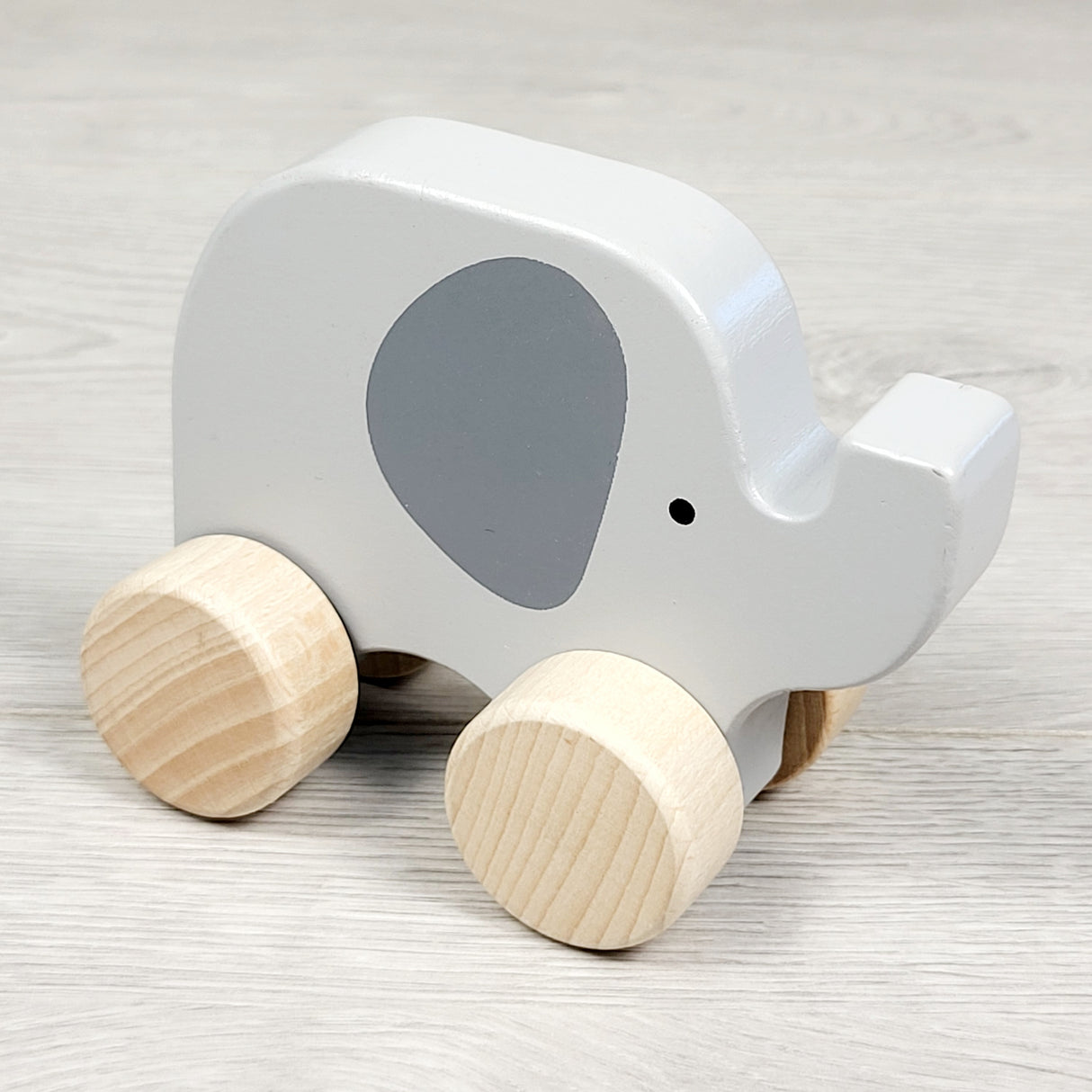 Hape wooden roll along elephant toy