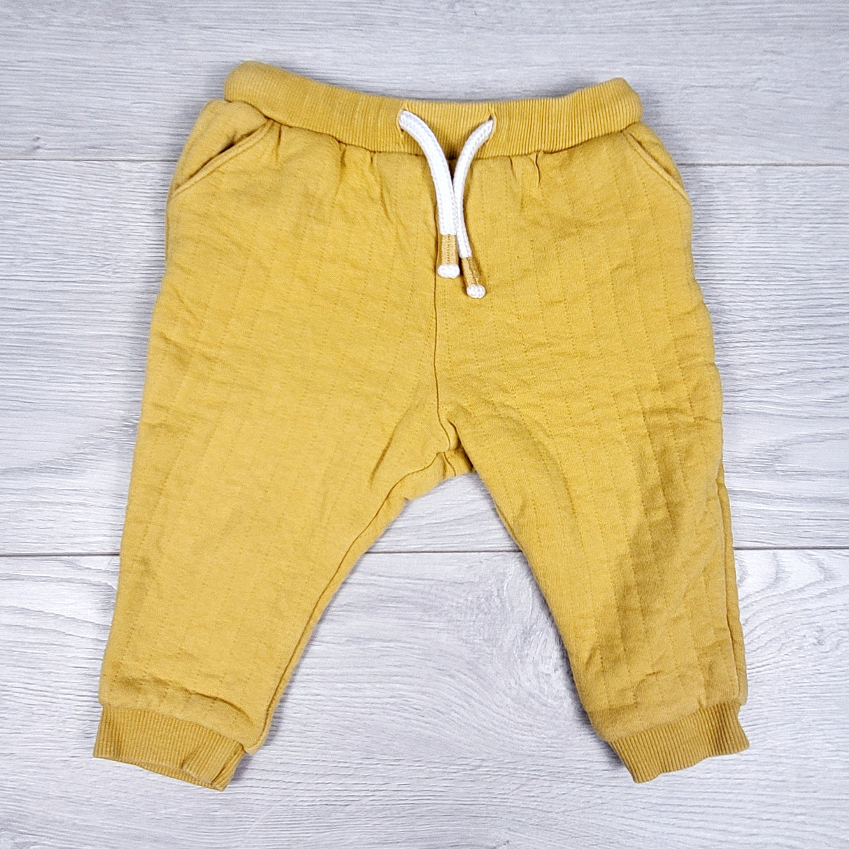 John Lewis yellow quilted cotton pants. Size 6-9 months