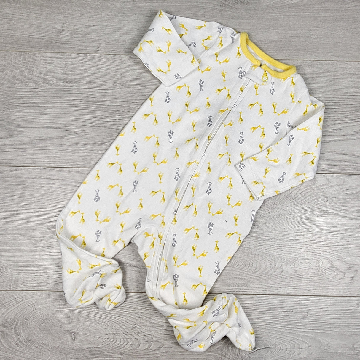 Simple Joys white zippered sleeper with giraffes. Size 6-9 months