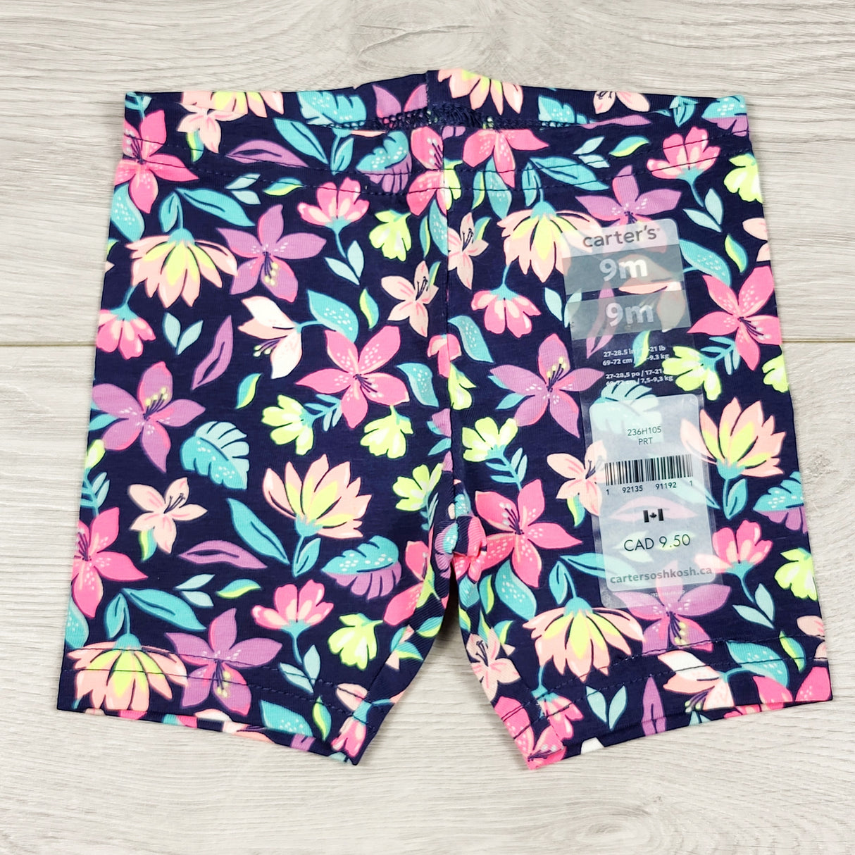 NEW - Carters navy floral print bicycle shorts. Size 9 months