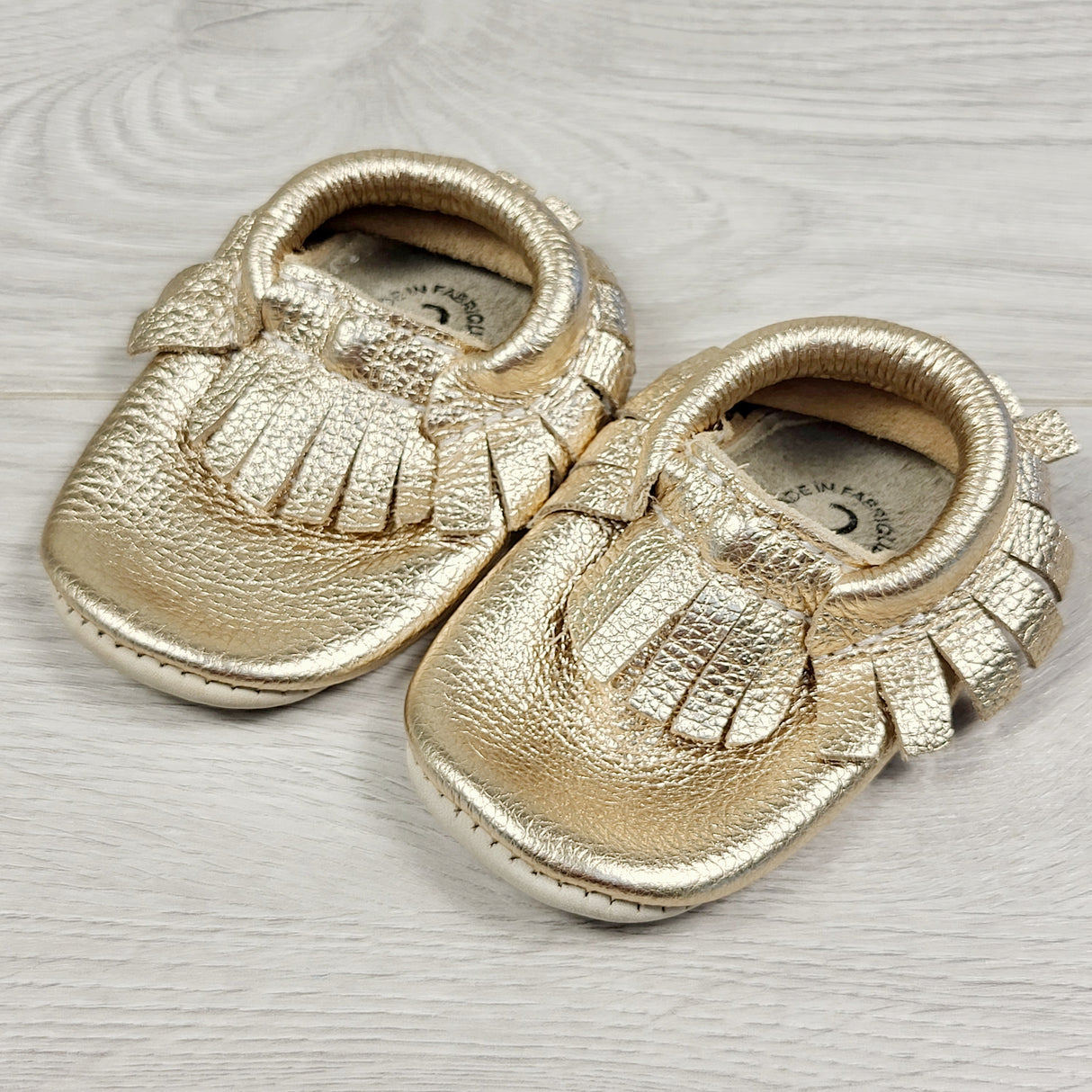 Minimoc gold soft soled leather shoes. Size 2 (infant)