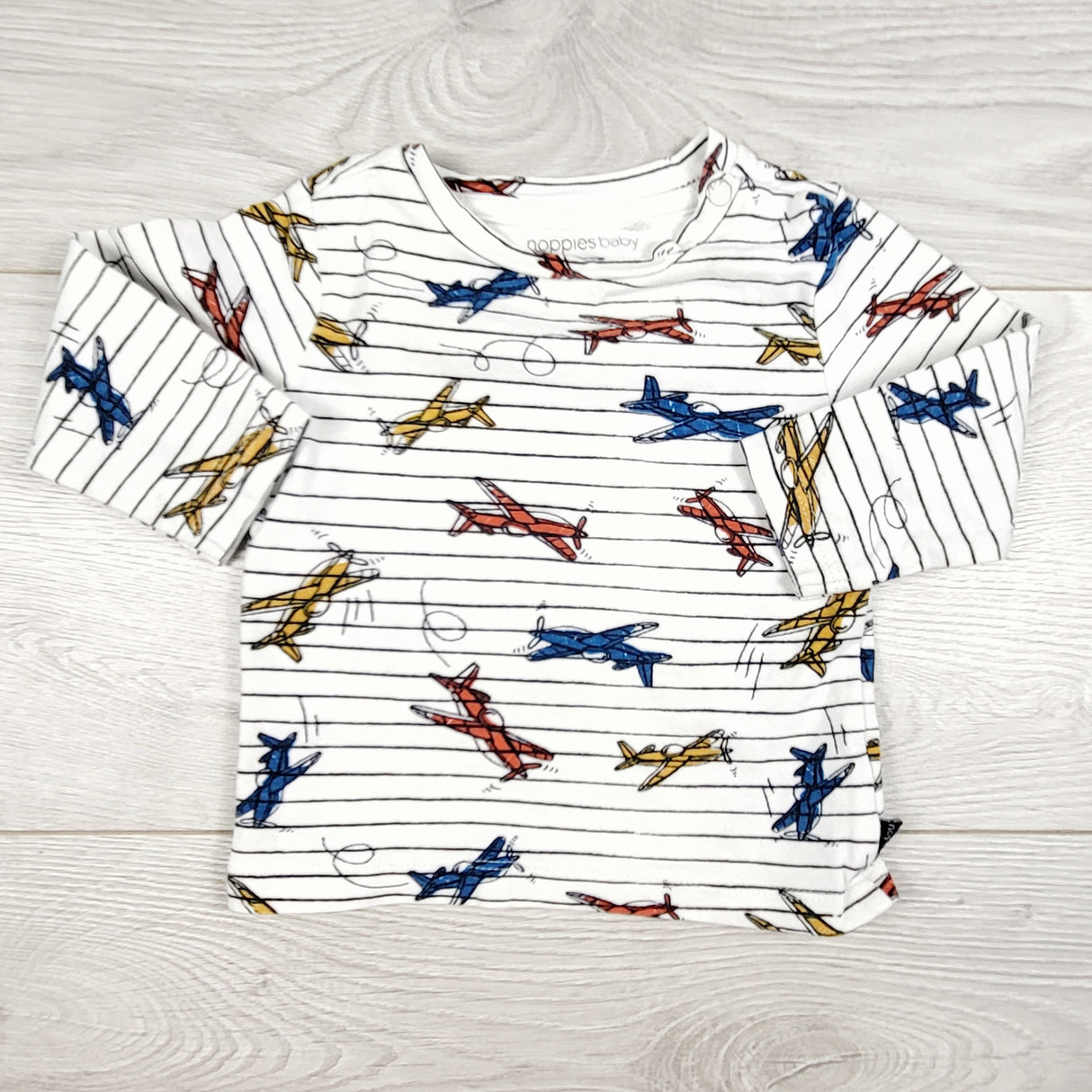 Noppies striped long sleeve top with airplanes. Size 2-4 months