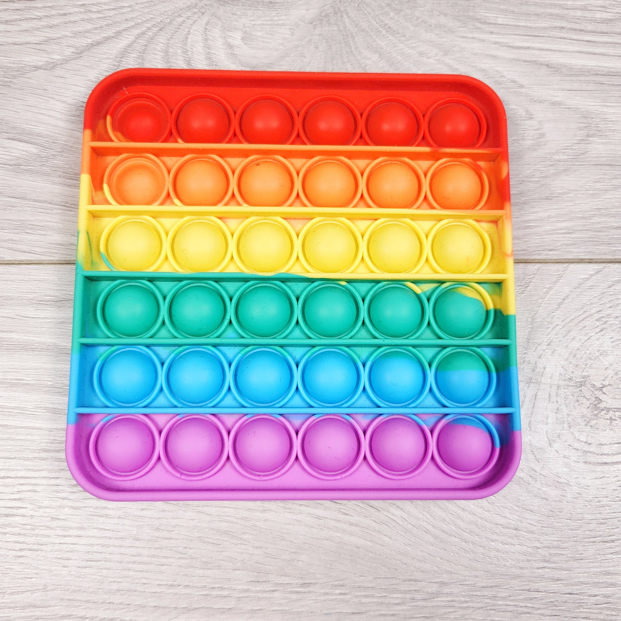 Rainbow pop-it fidget toy