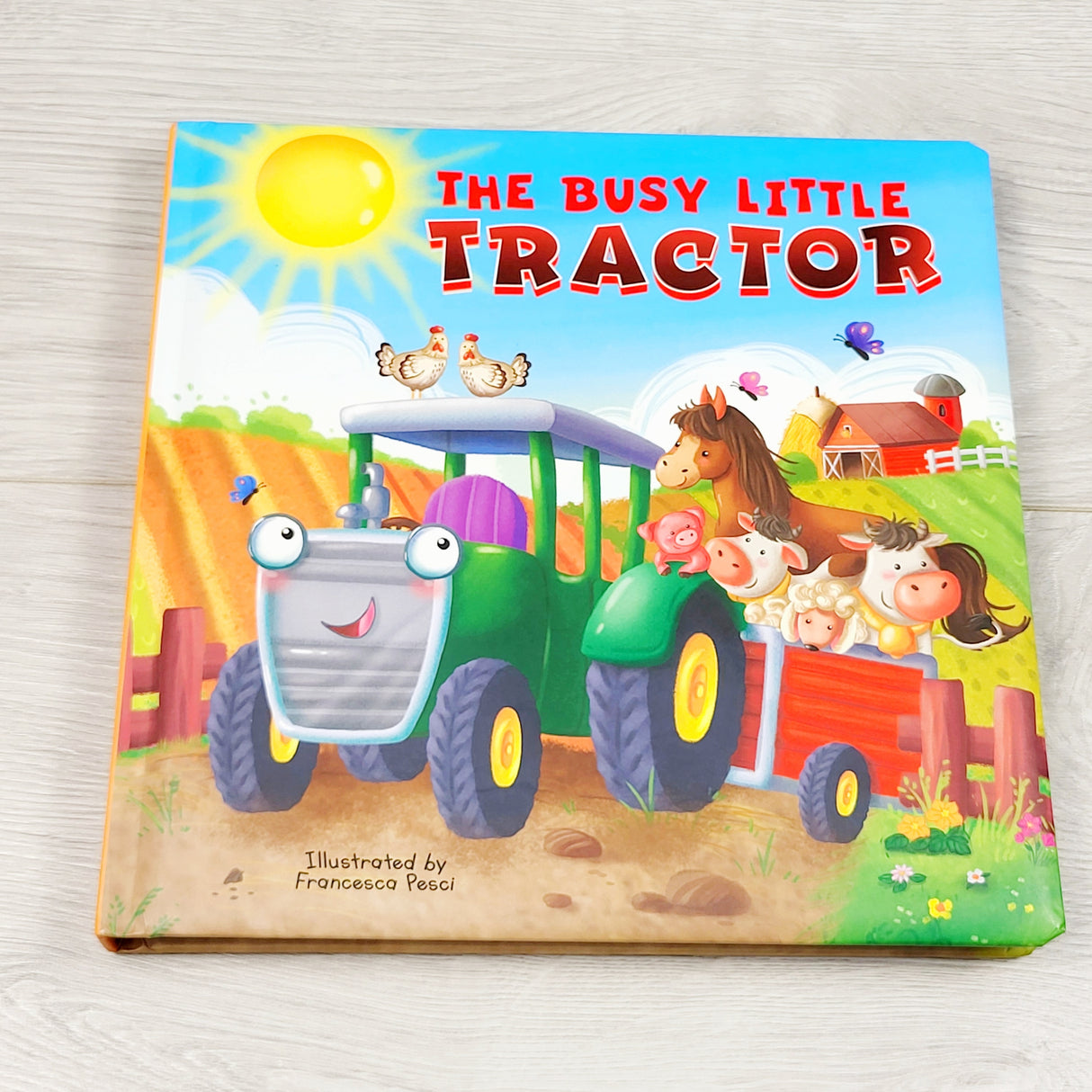 The Busy Little Tractor. Board book