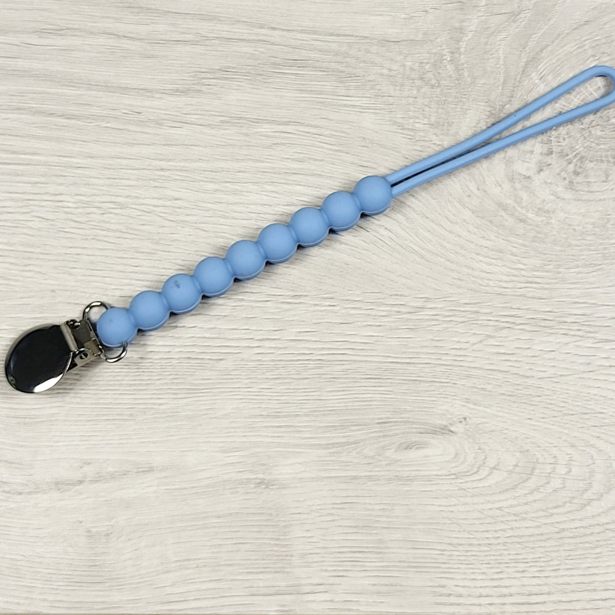 Blue silicone pacifier clip