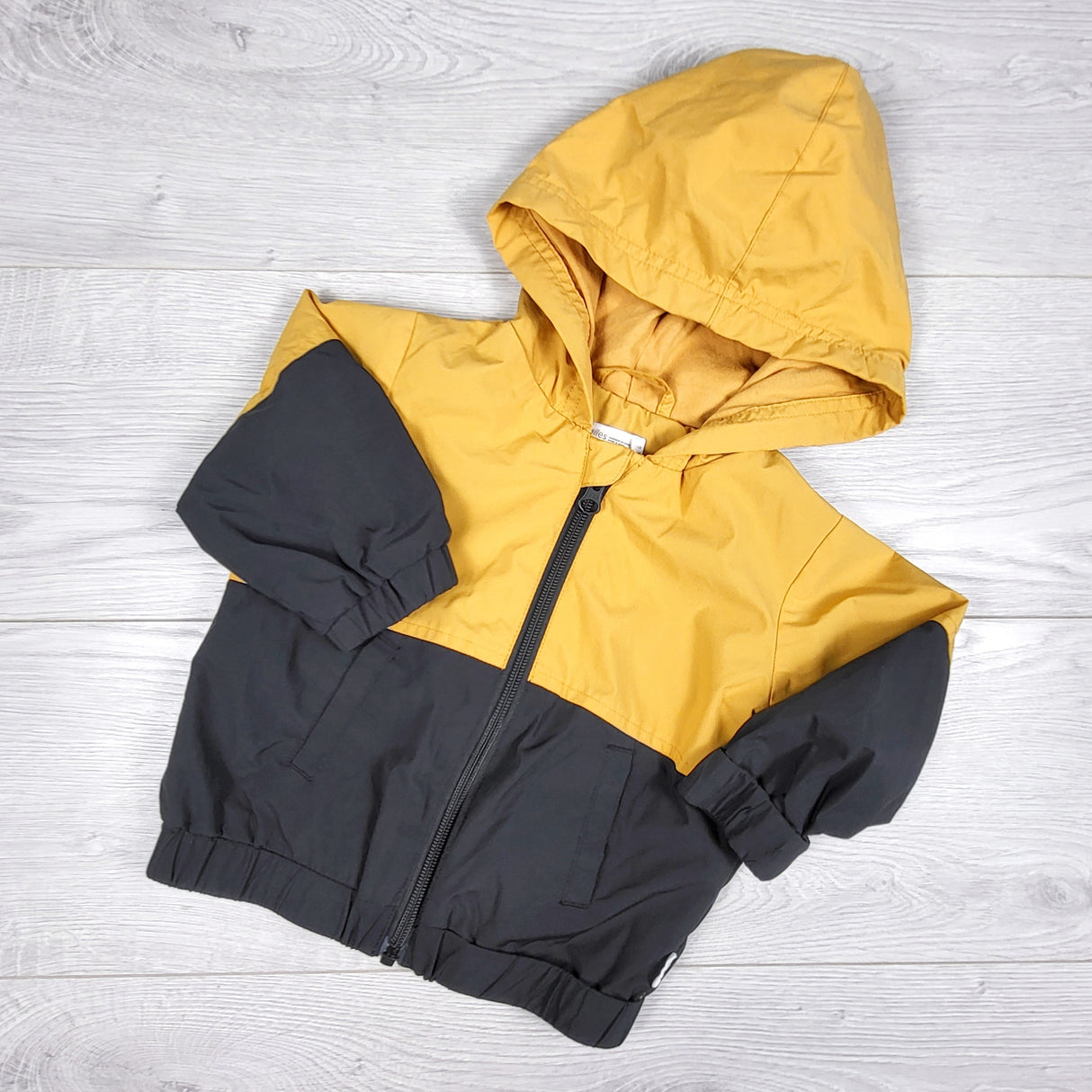 Miles Baby black and yellow jersey lined hooded jacket. Size 12 months