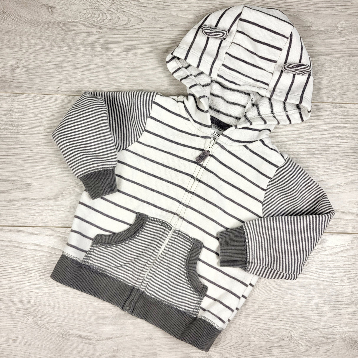 Carters white and grey striped zippered hoodie. Size 12 months