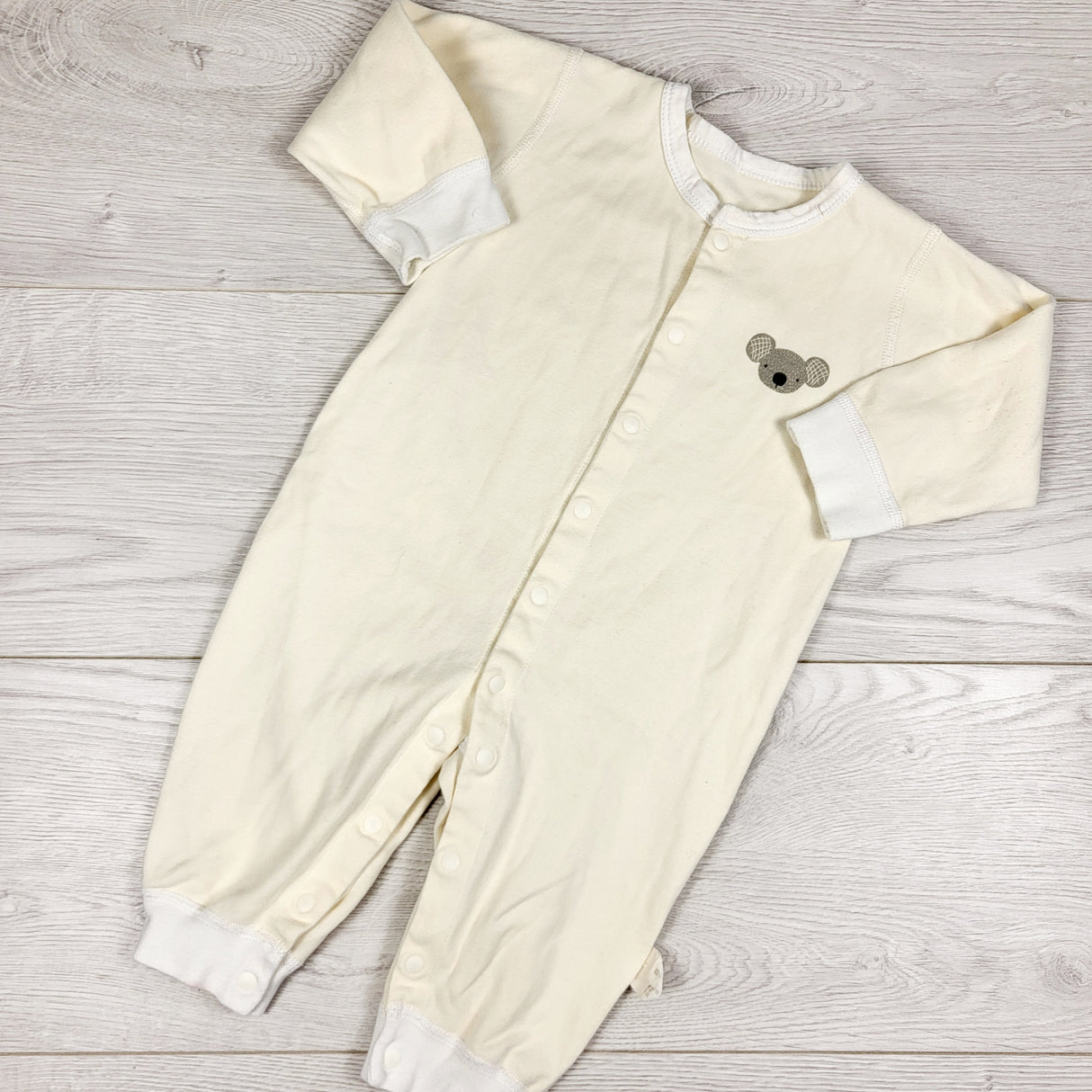 Pale yellow sleeper with koala. Size 6-9 months