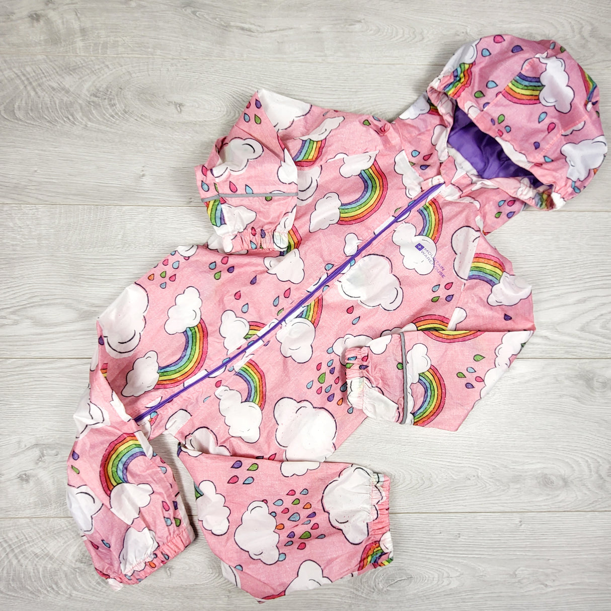Mountain Warehouse pink one piece rain suit with rainbows. Size 18-24 months