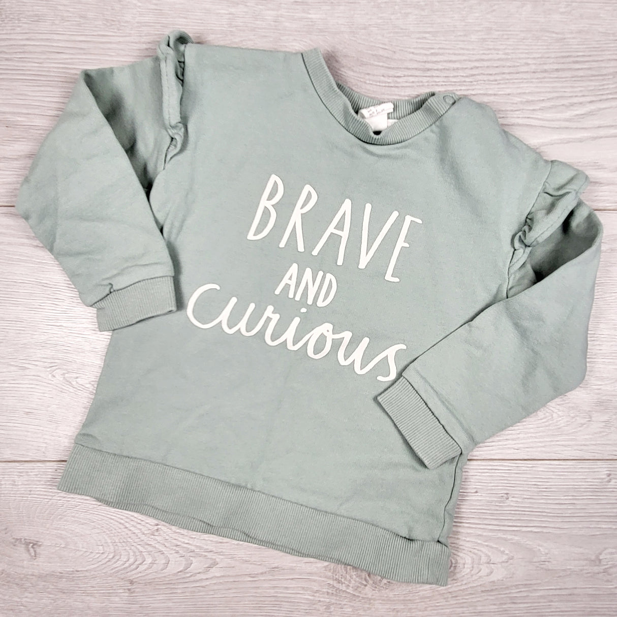 H and M green "Brave and Curious" sweatshirt. Size 18-24 months