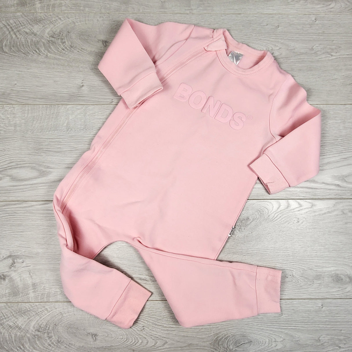 Bonds pink tech zip coveralls. Size 18-24 months (sweatshirt material)