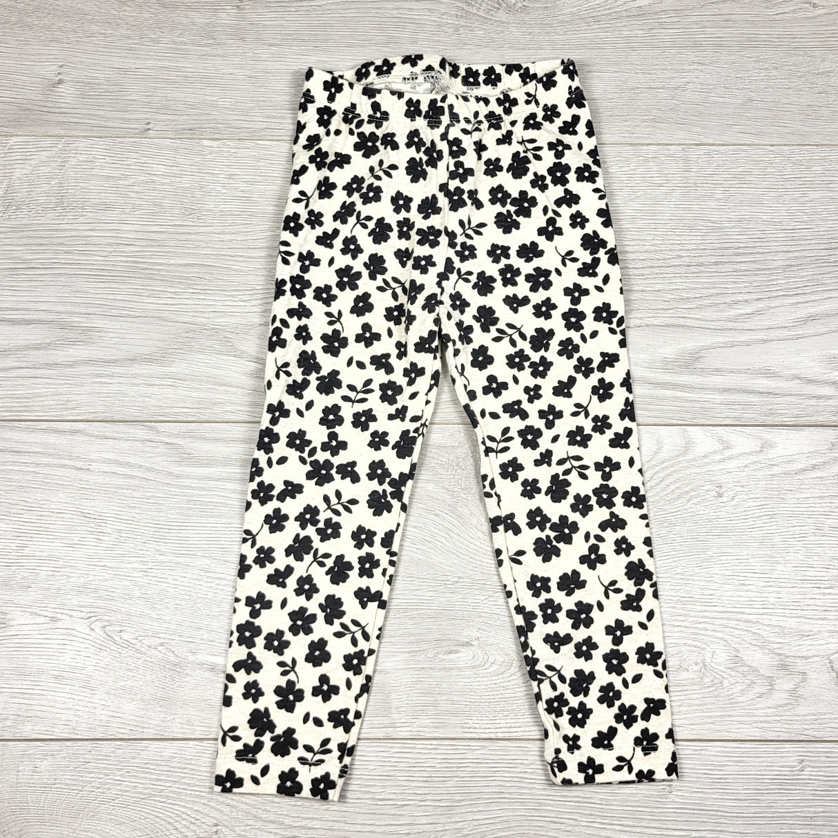 Old Navy beige and black floral print leggings. Size 2T