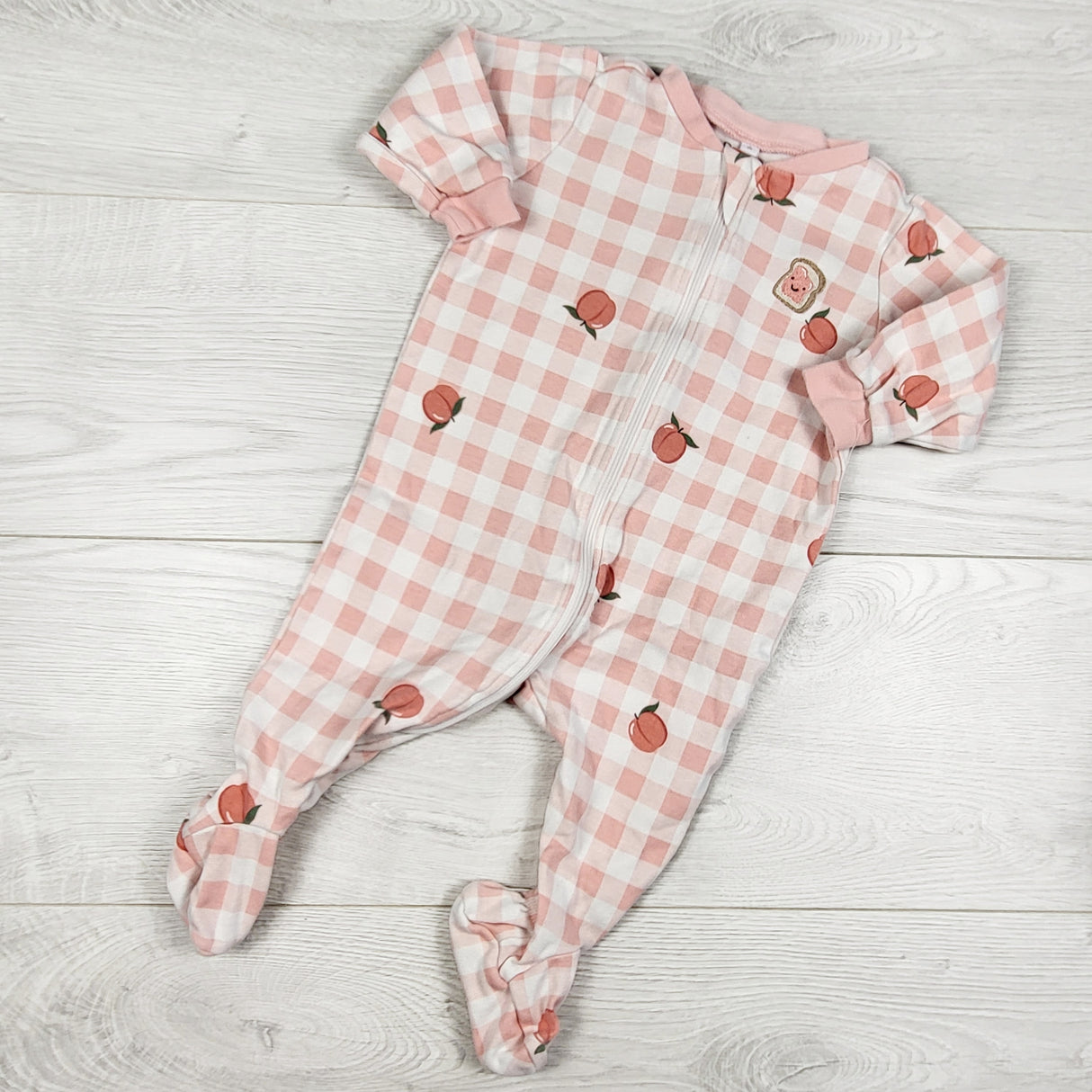 Pekkle pink checker print zleeper with peaches. Size 6 months