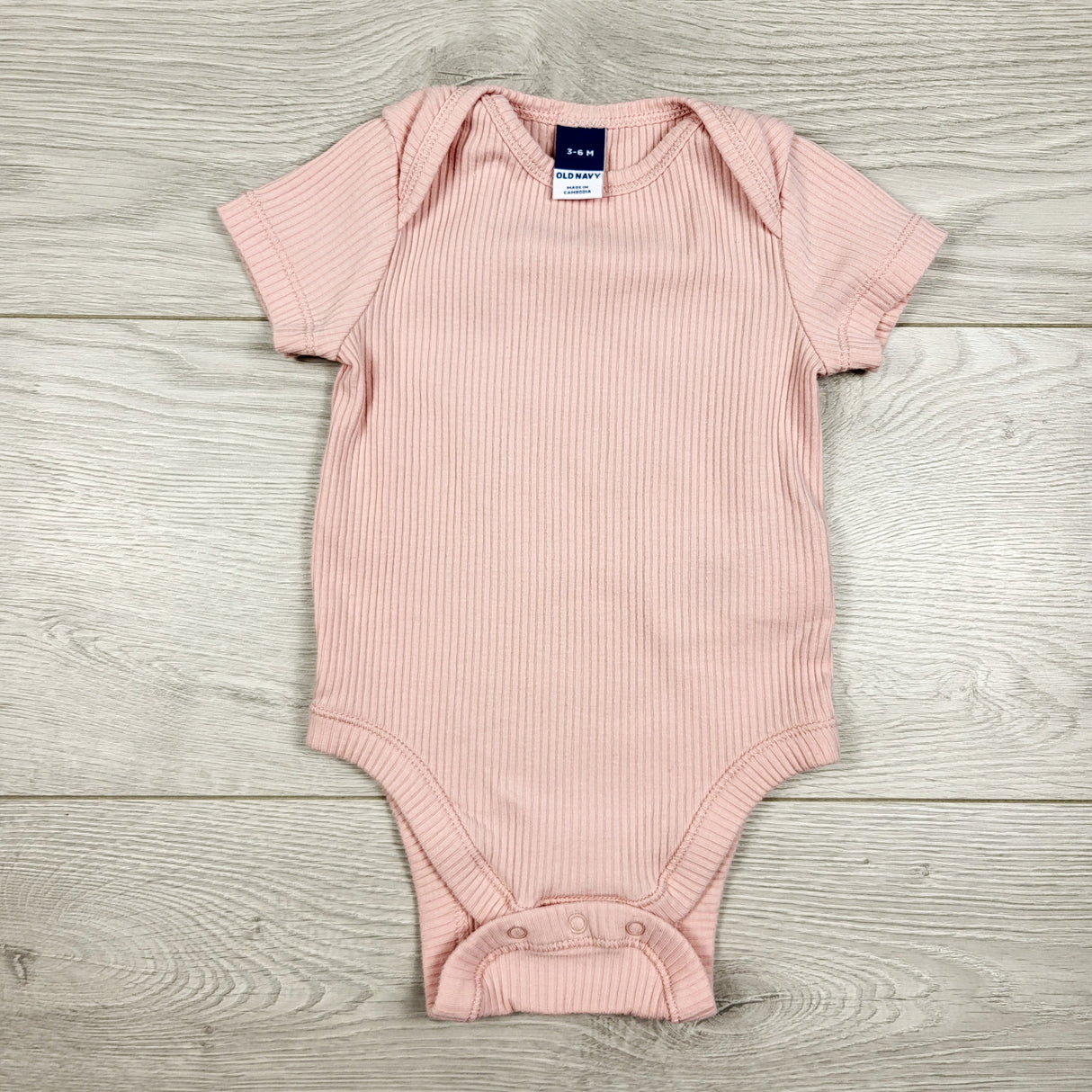 Old Navy pink ribbed bodysuit. Size 3-6 months