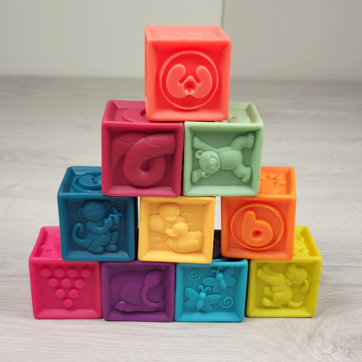 B. Toys Battat B.Baby One Two Squeeze soft blocks