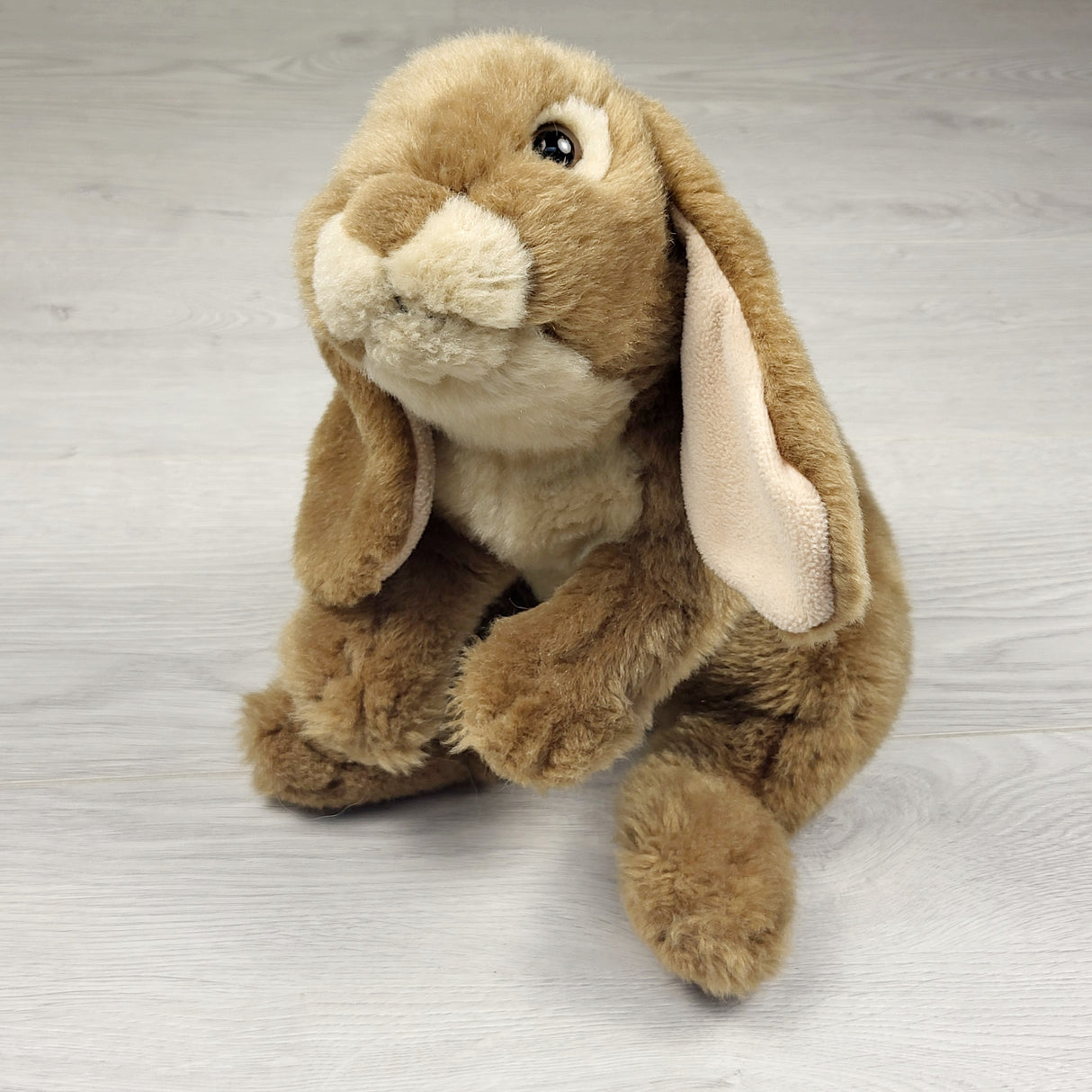 Plush 12 inch bunny in sitting position - weighted bum.  Sorry, no shipping