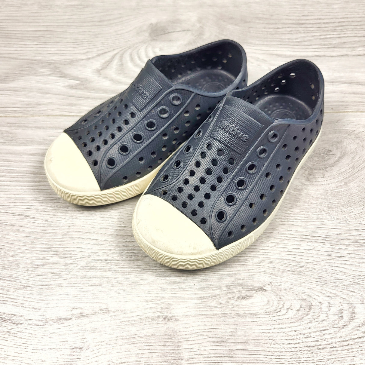 Native brand black rubber shoes. Size 7