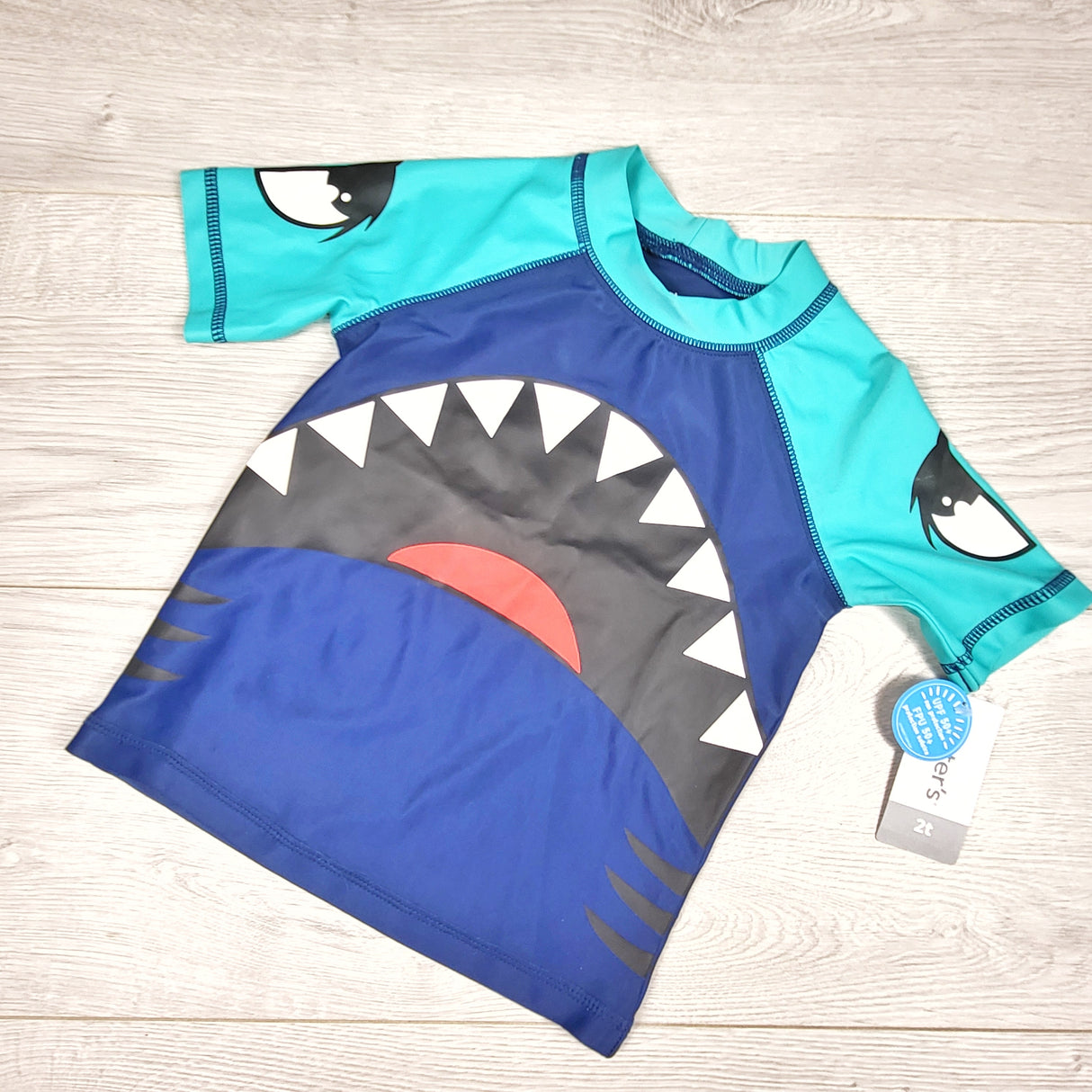 NEW - Carters blue and turquoise rash guard with shark mouth. Size 2T