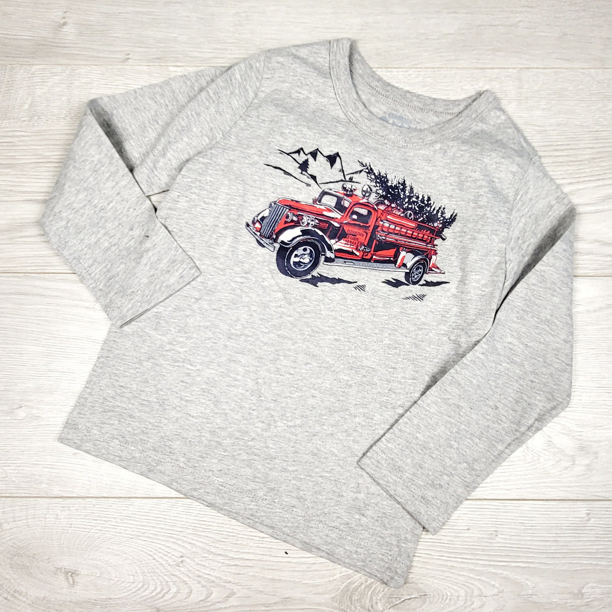 Oshkosh grey top with tree in fire truck. Size 4T