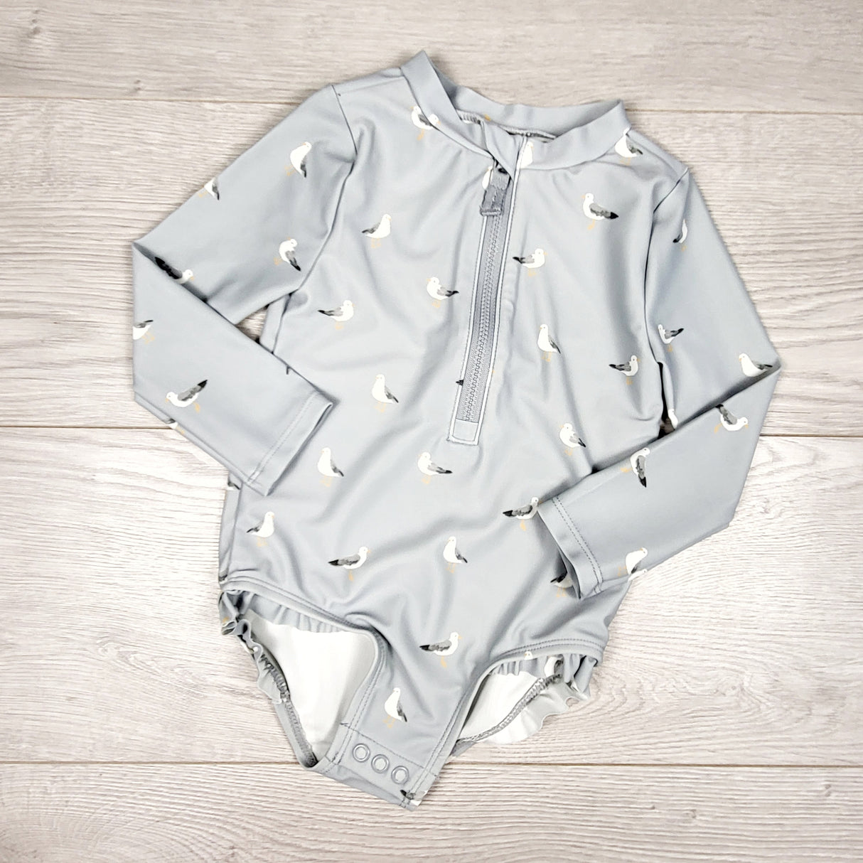 Little Planet blue-grey one piece swimsuit with seagulls. Size 18 months