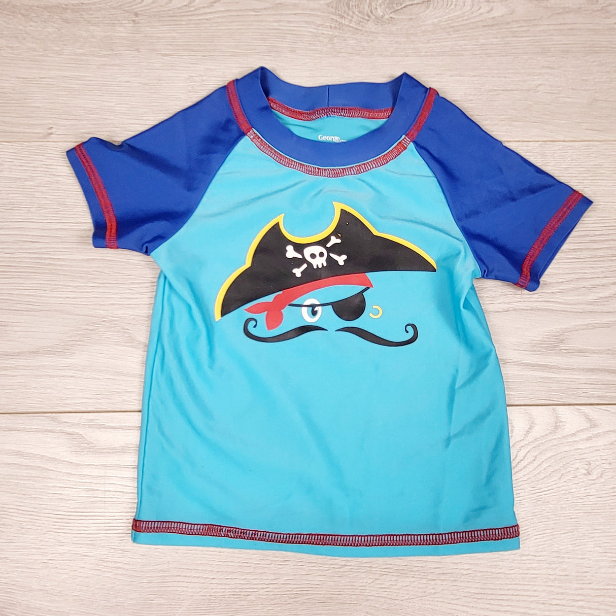 George blue rash guard with pirate. Size 24 months