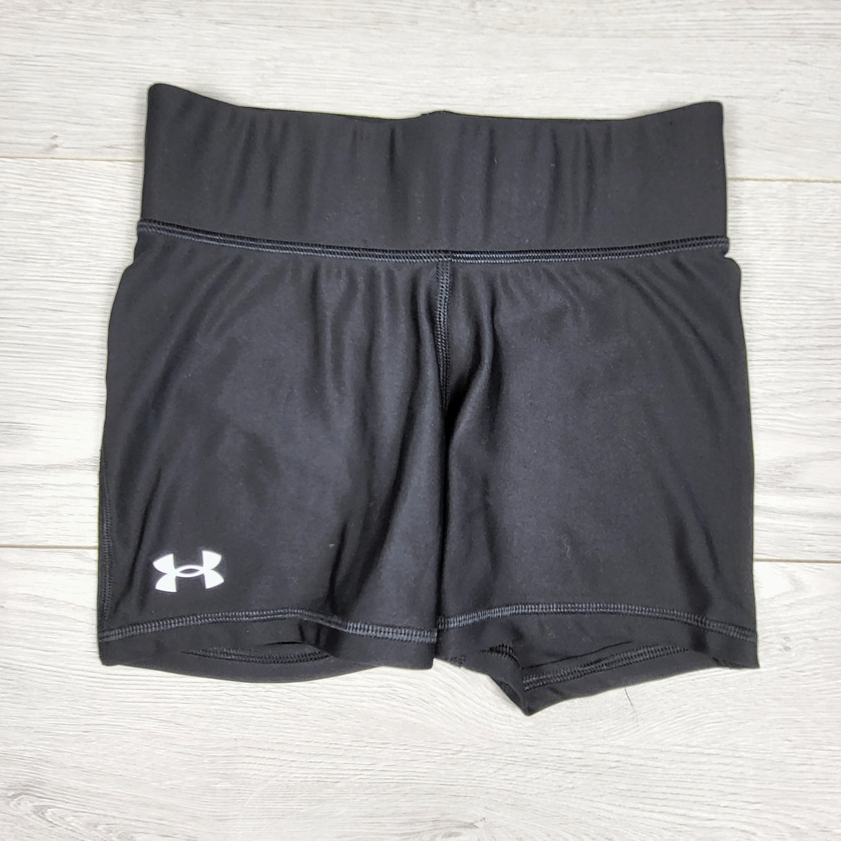Under Armour black shorty heat gear shorts. Size like a youth size medium