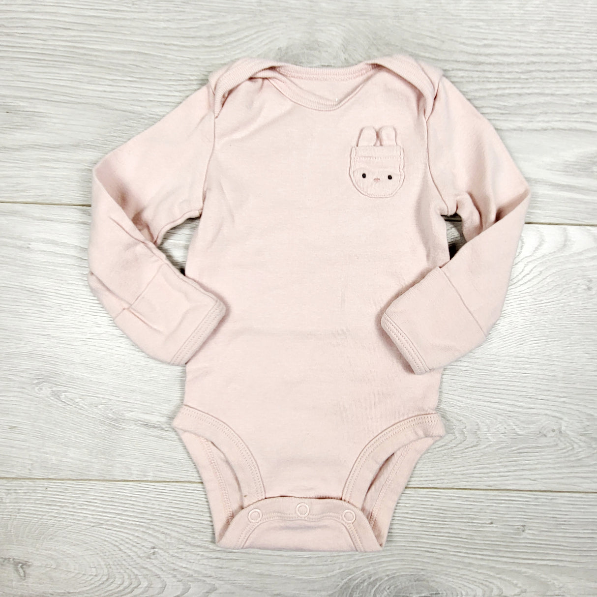Carters pink bodysuit with bunny pocket. Size 3 months