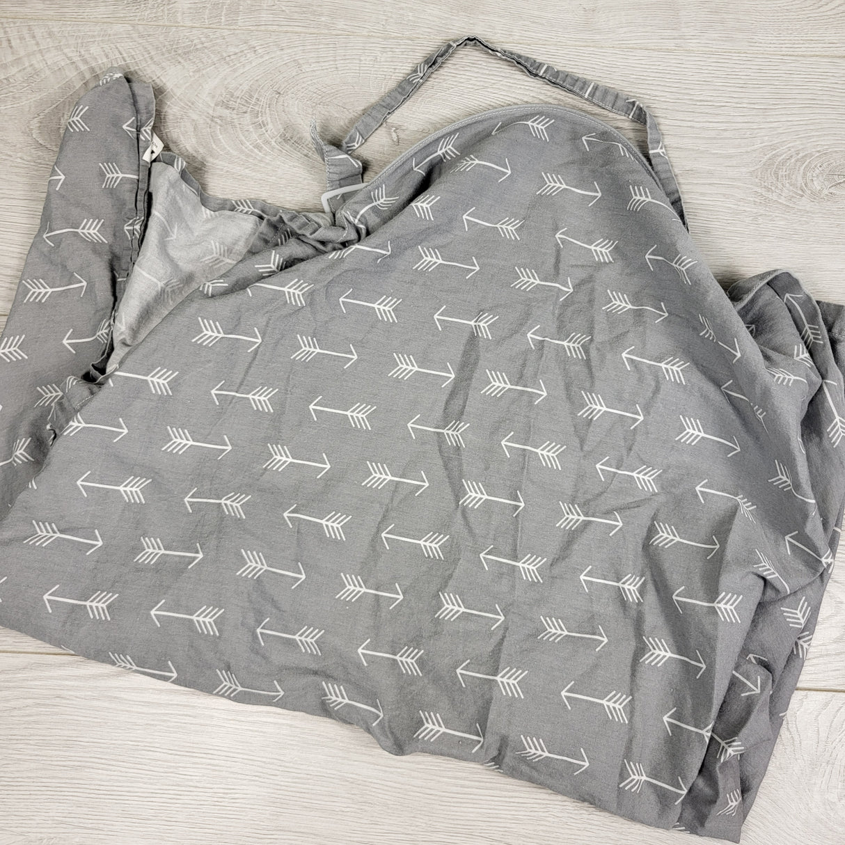 Grey nursing cover with arrows