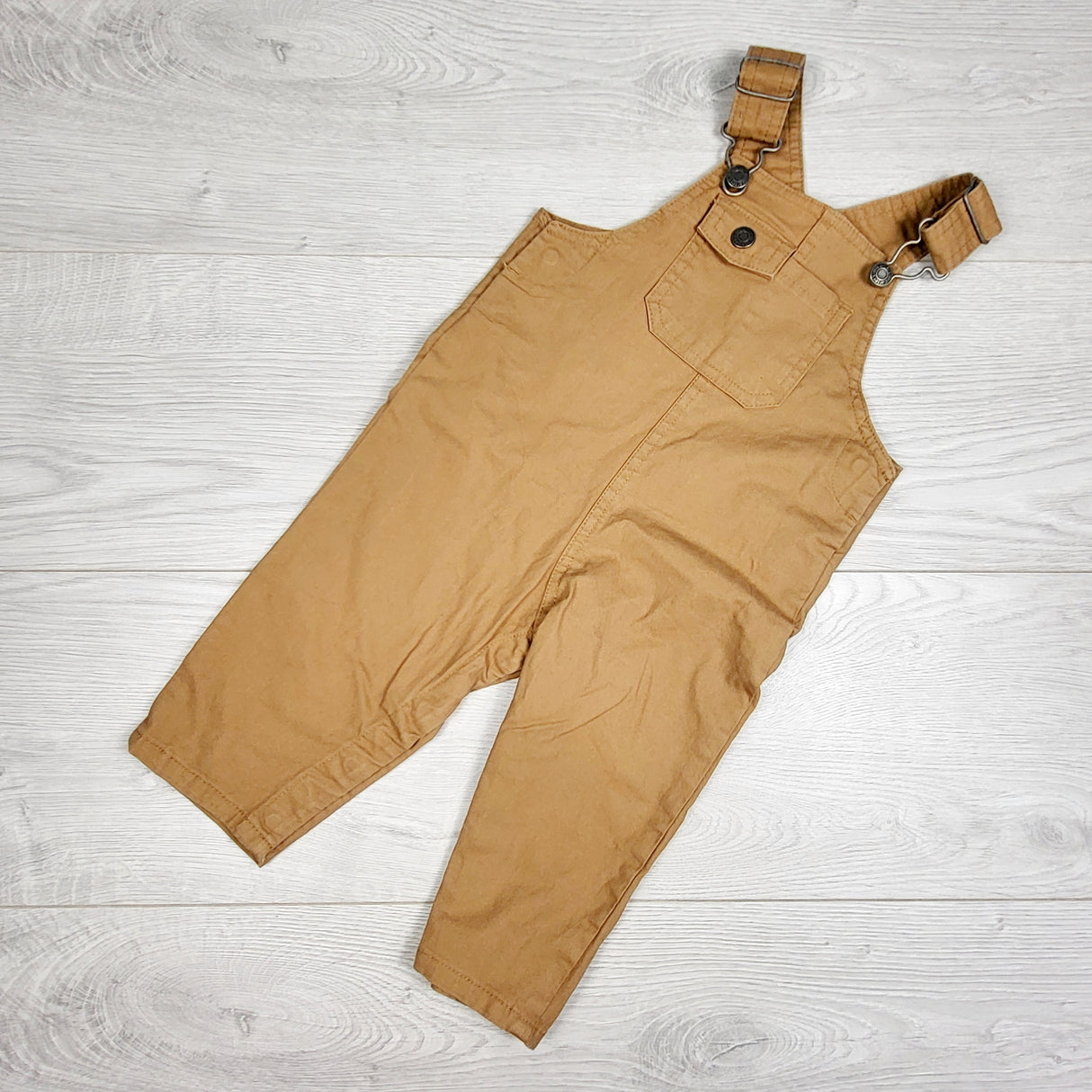 Carters tan twill overalls. Size 6 months