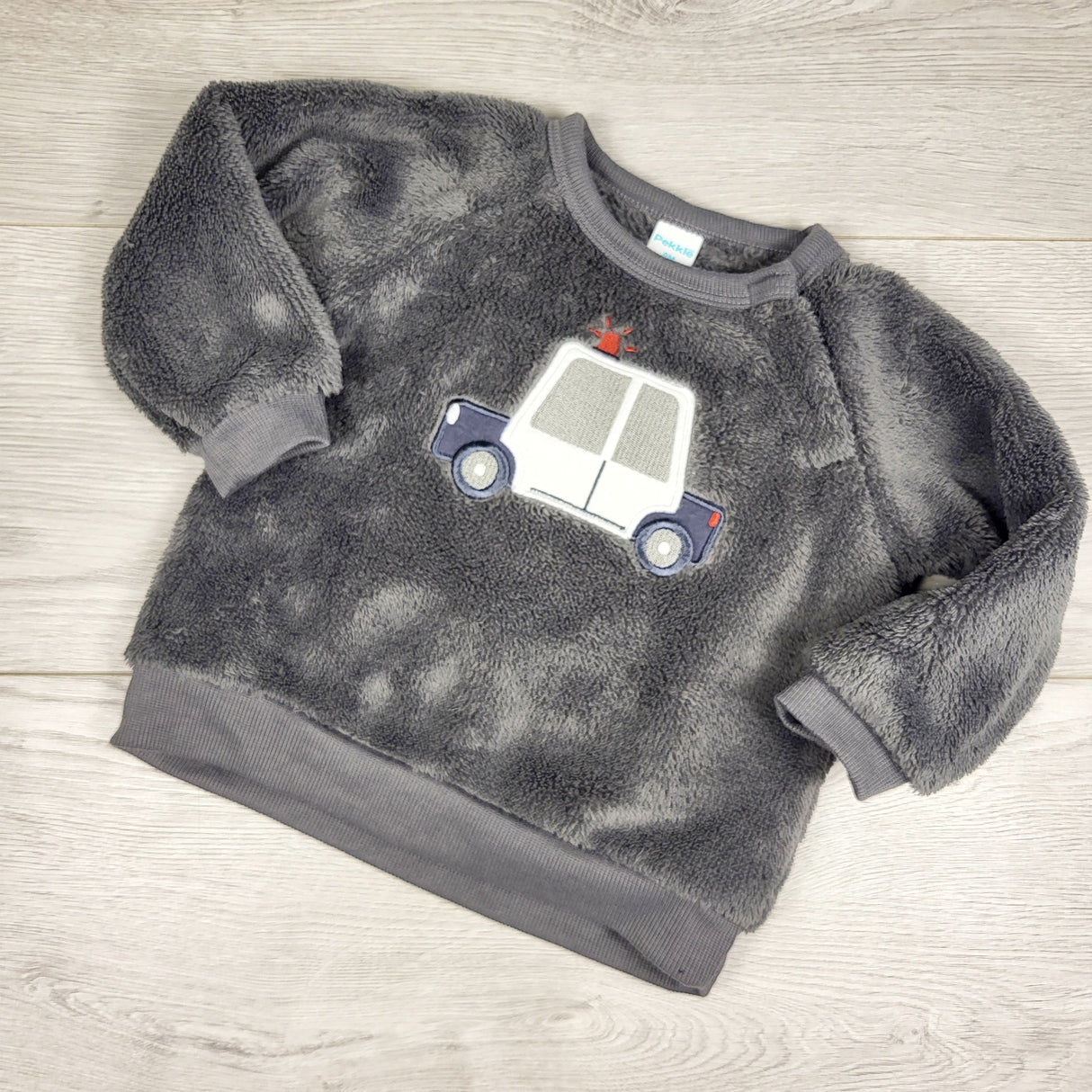 Pekkle grey plush sweatshirt with police car. Size 9 months