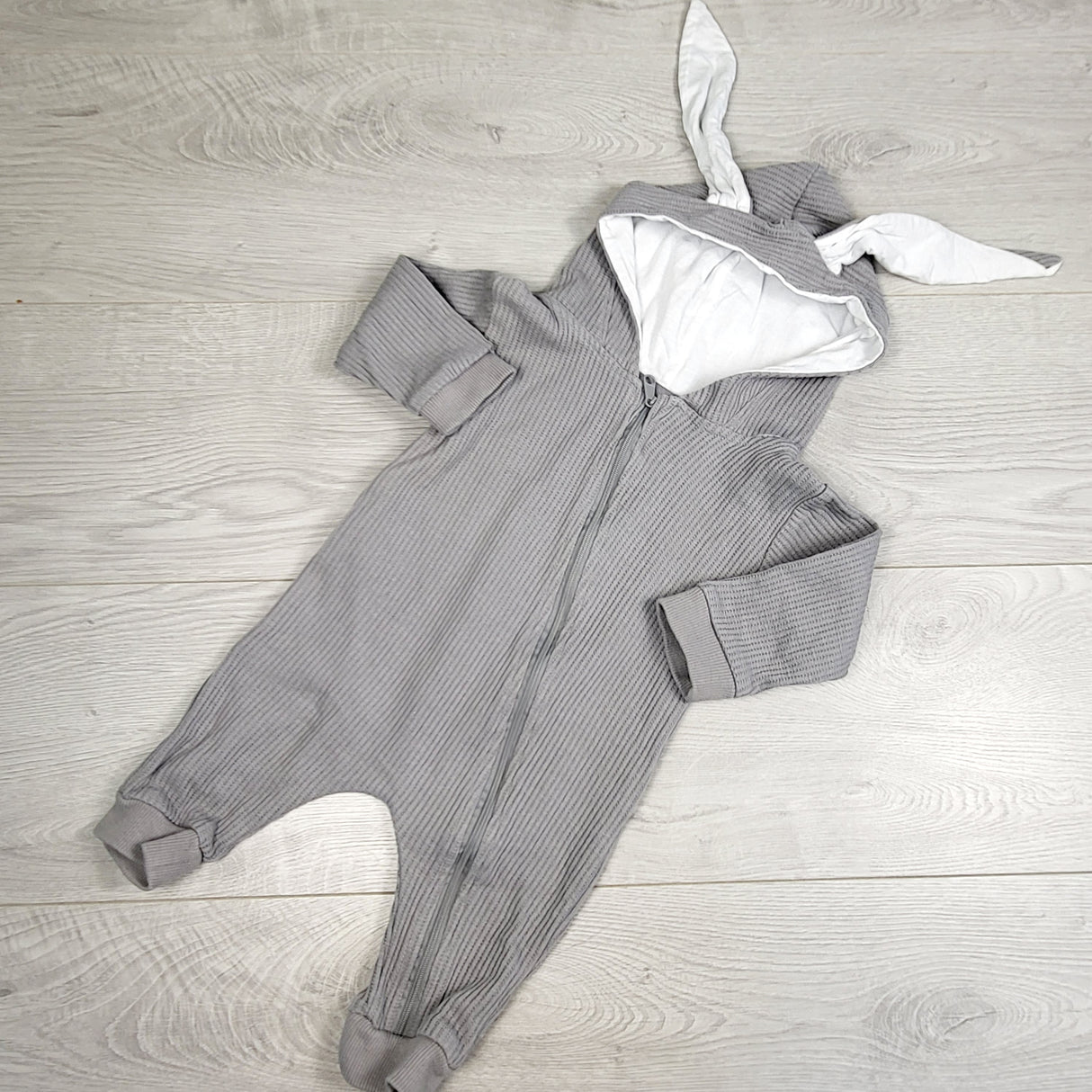 The Littlest grey waffle knit romper with bunny ears. Size 3-6 months