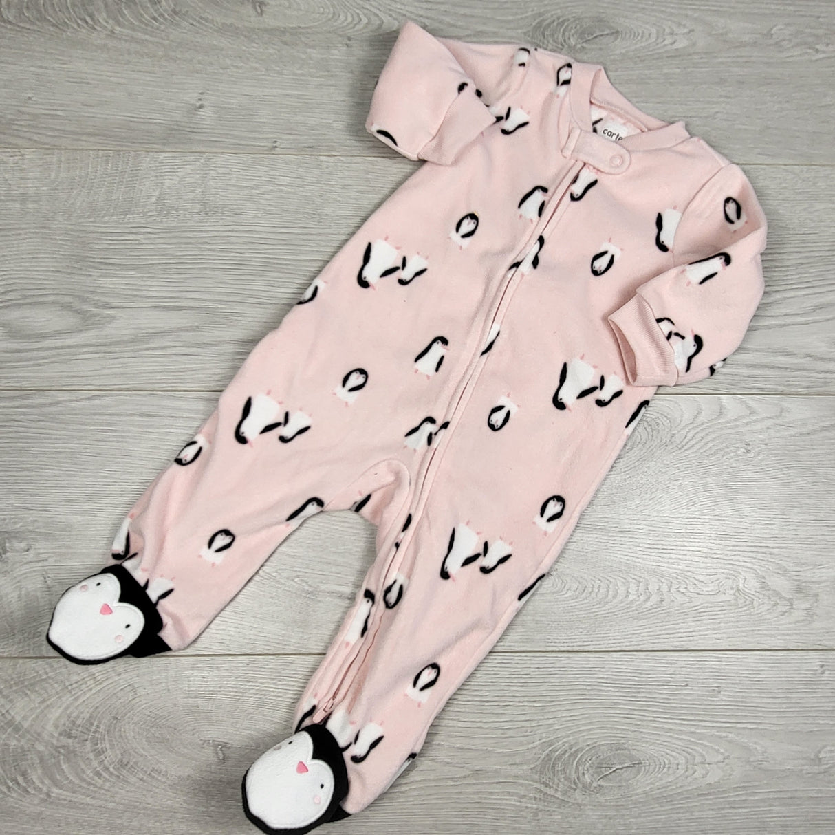 Carters pink zippered fleece sleeper with penguins. Size 6 months