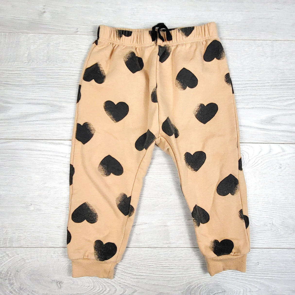 PL Baby tan fleecy lined pants with hearts. Size 24 months