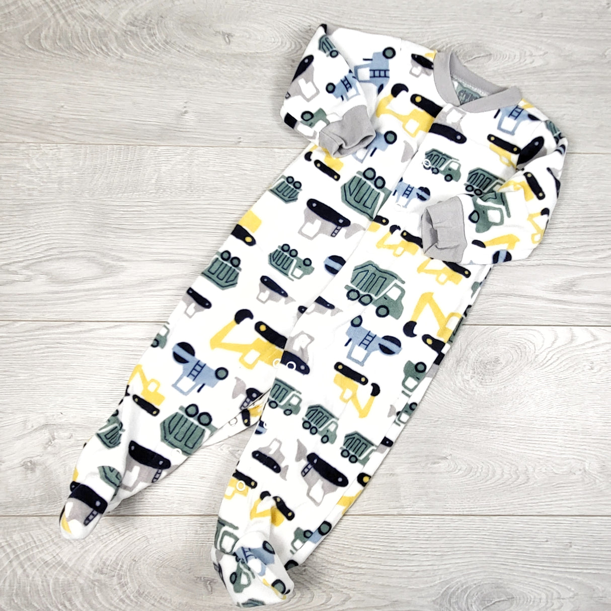 Child of Mine white fleece sleeper with construction theme. Size 6-9 months