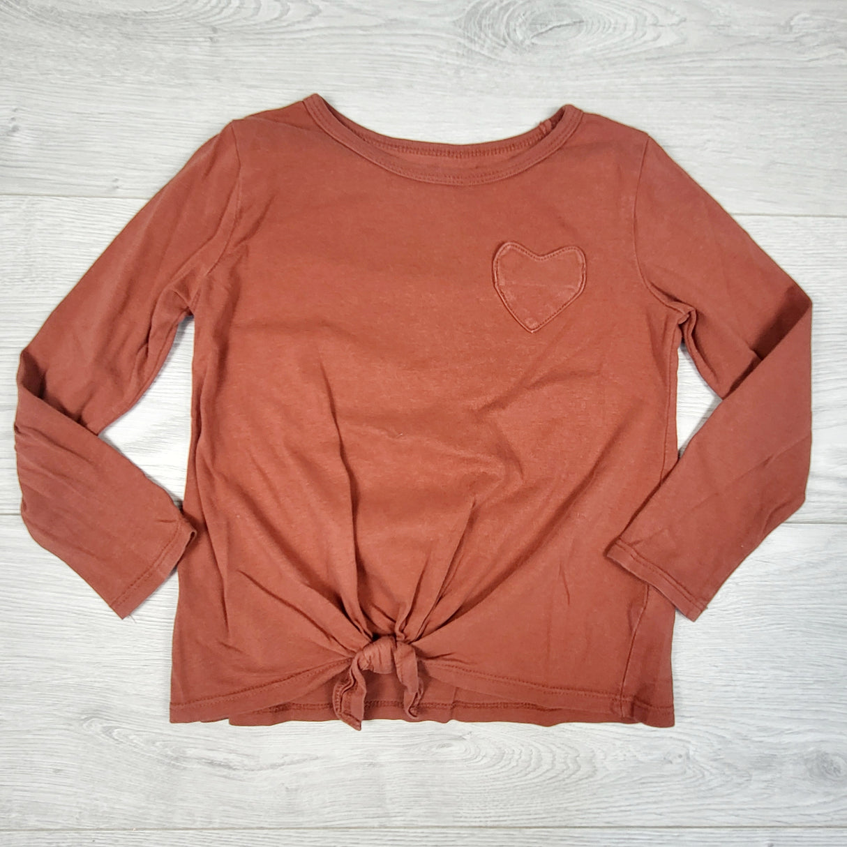 Carters carmel knotted top with heart pocket. Size 4T