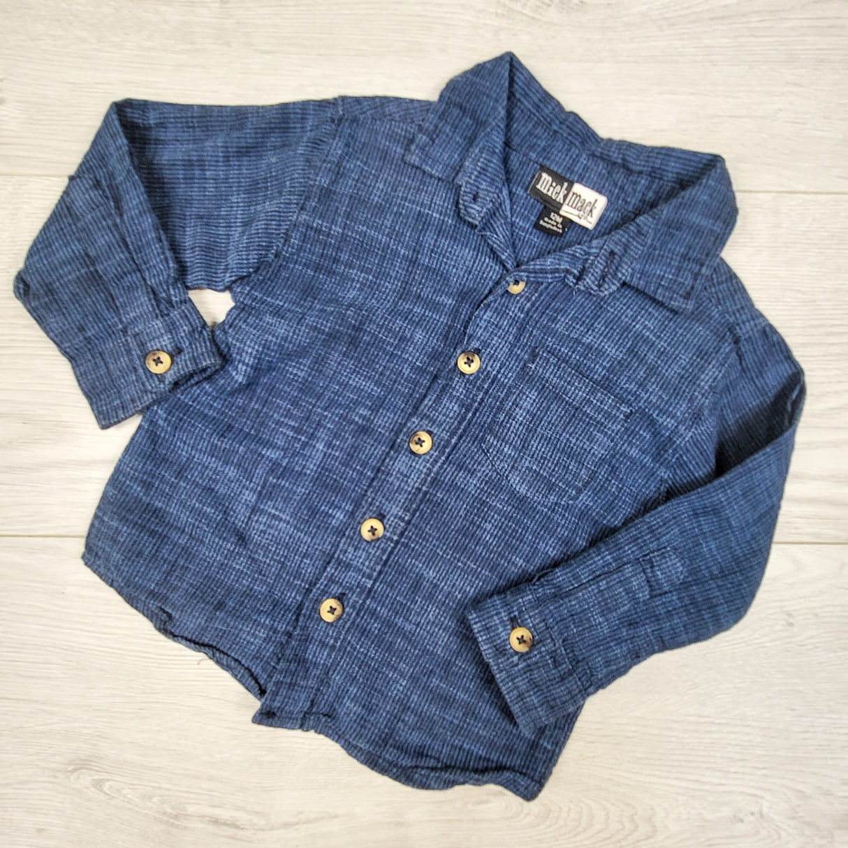 Mick and Mack blue textured button down shirt. Size 12 months