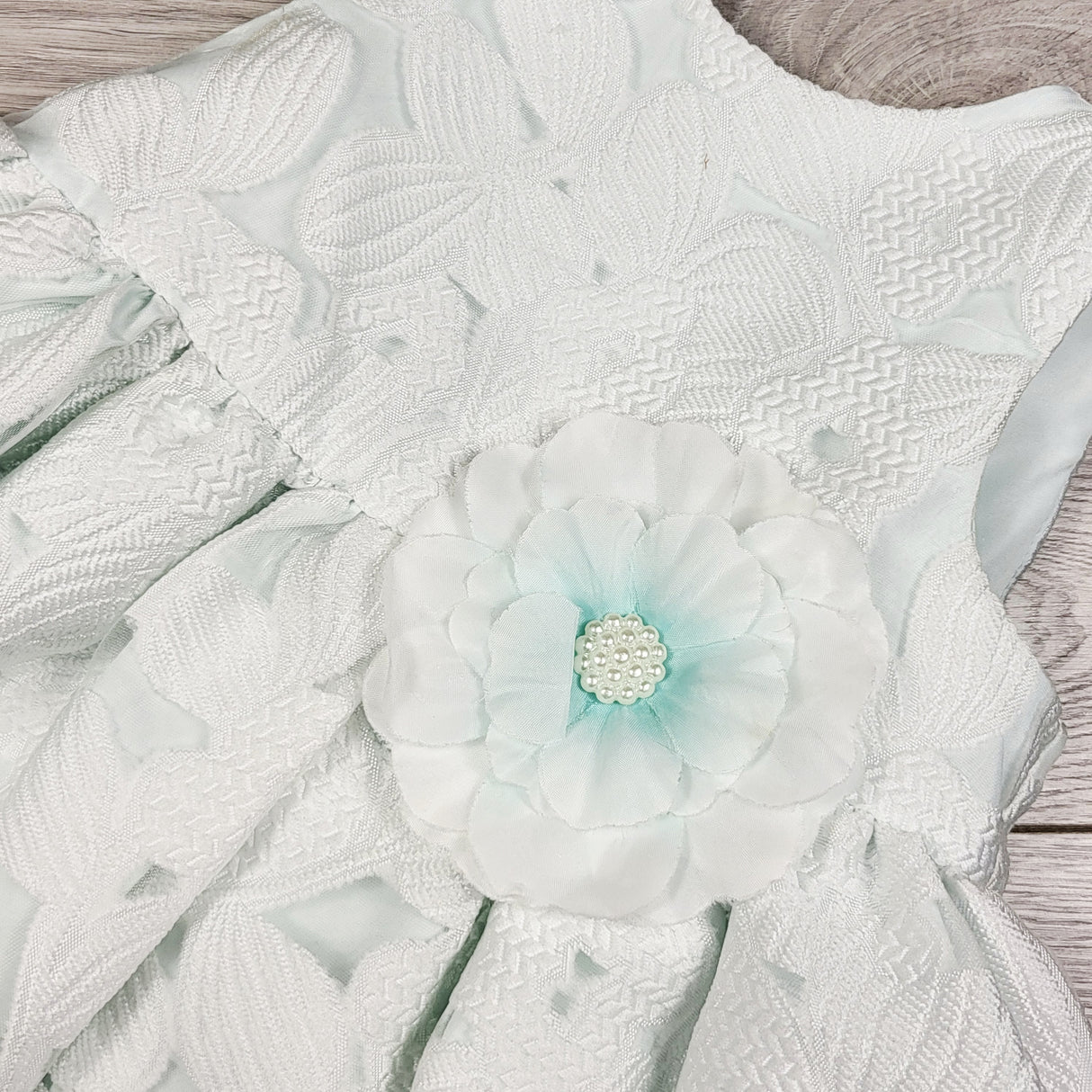 Marmellata special occasion dress with icy mint undertones. Size 12 months