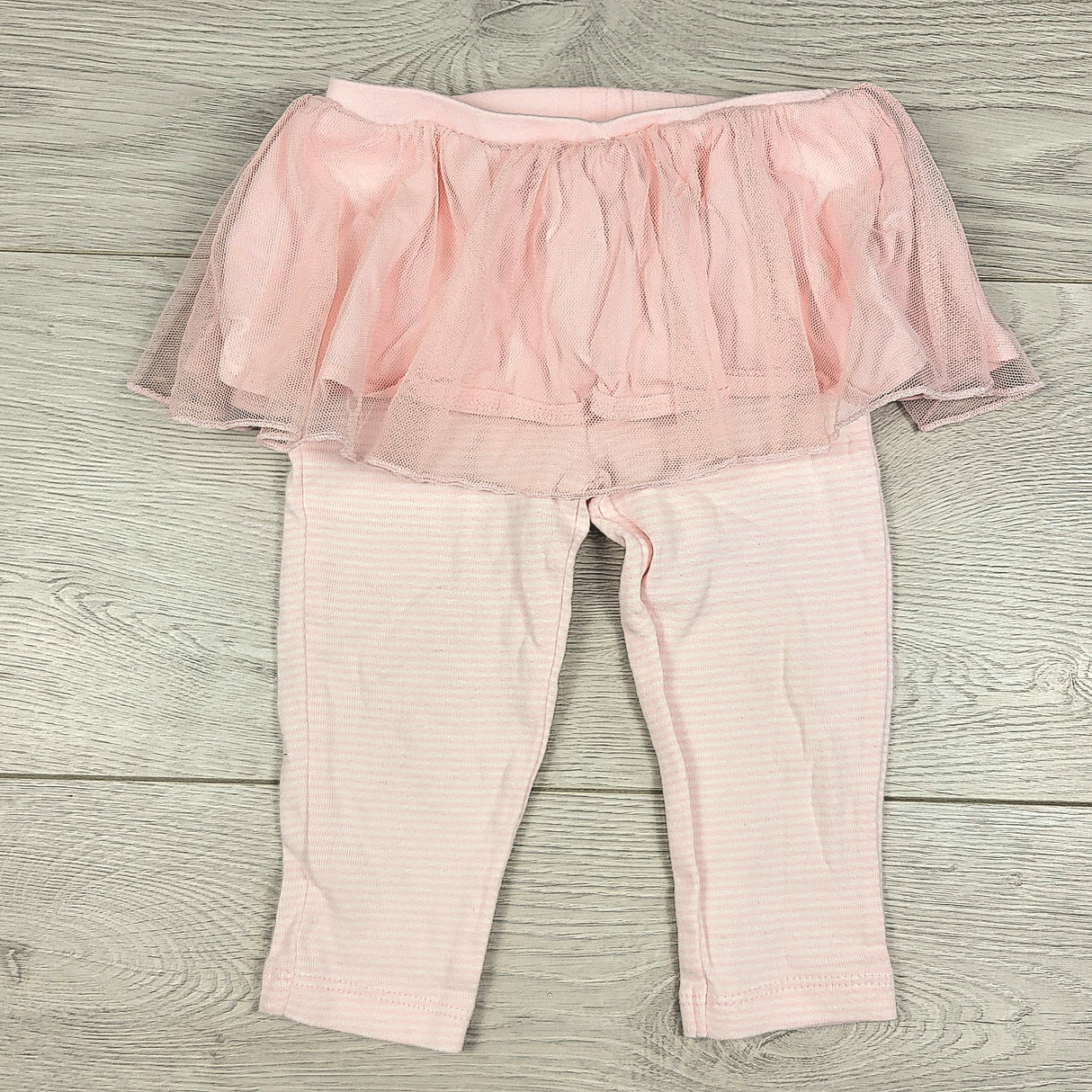 Carters pink striped leggings with attached tutu skirt. Size 9 months