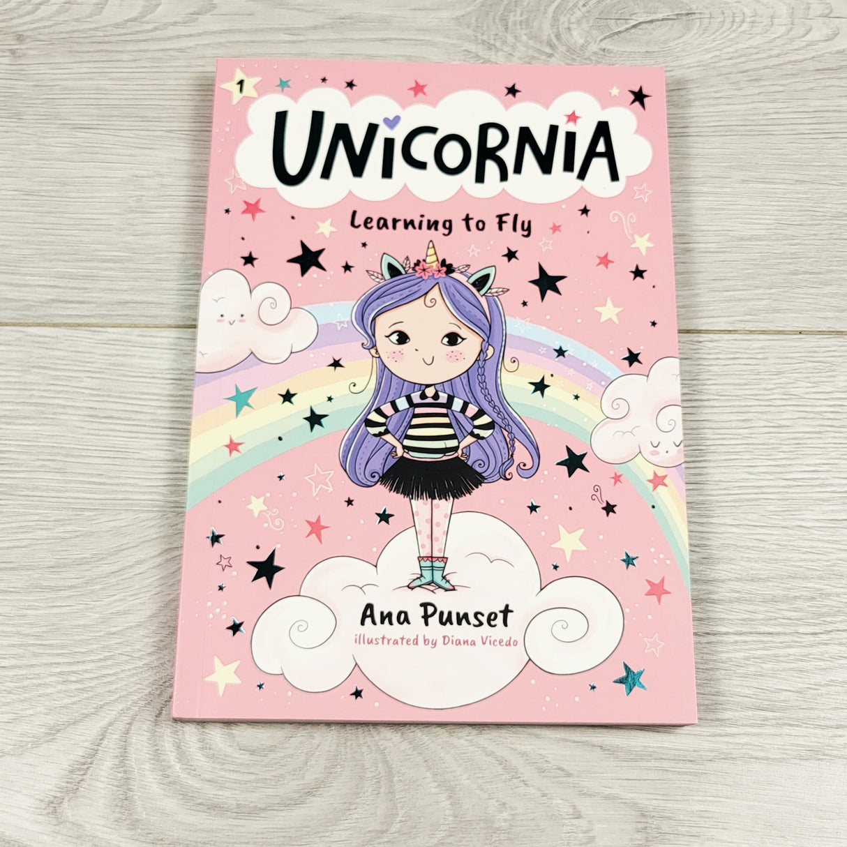 Unicornia: Learning to Fly. Soft cover book