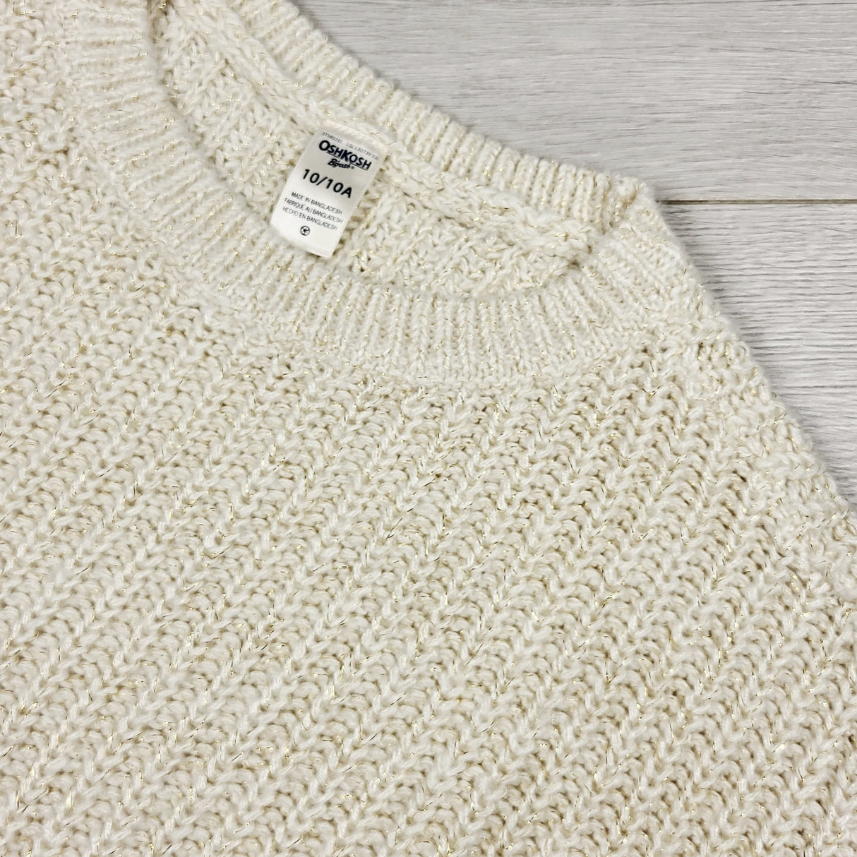 Oshkosh cream coloured sweater with gold sparkles. Size 10