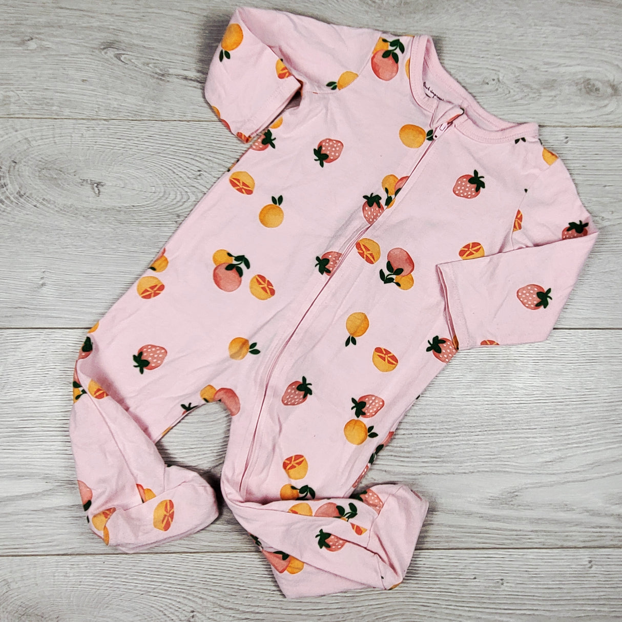 First Impression pink zippered sleeper with fruit. Size 6-9 months
