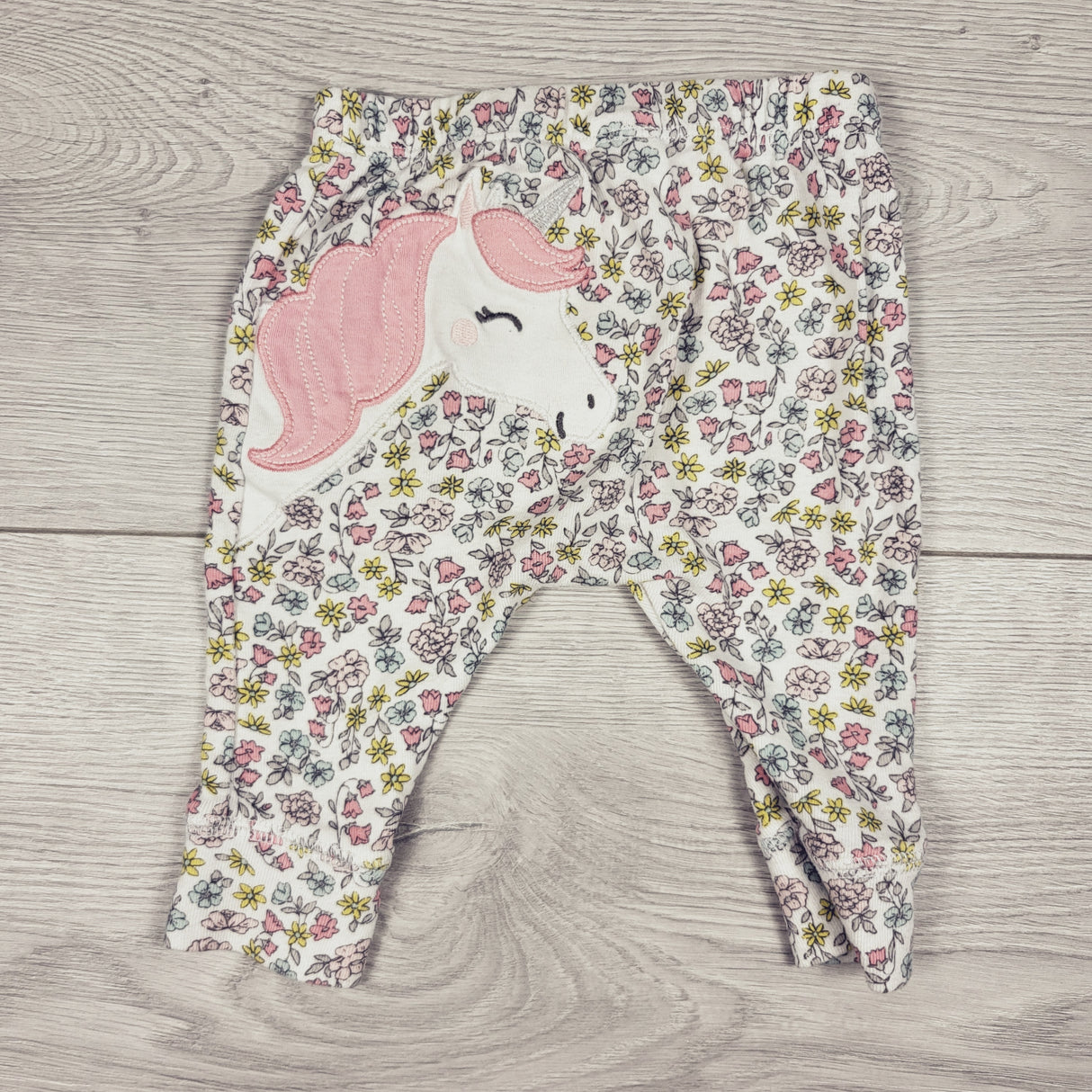Carters floral print leggings with unicorn on bum. Size 3 months