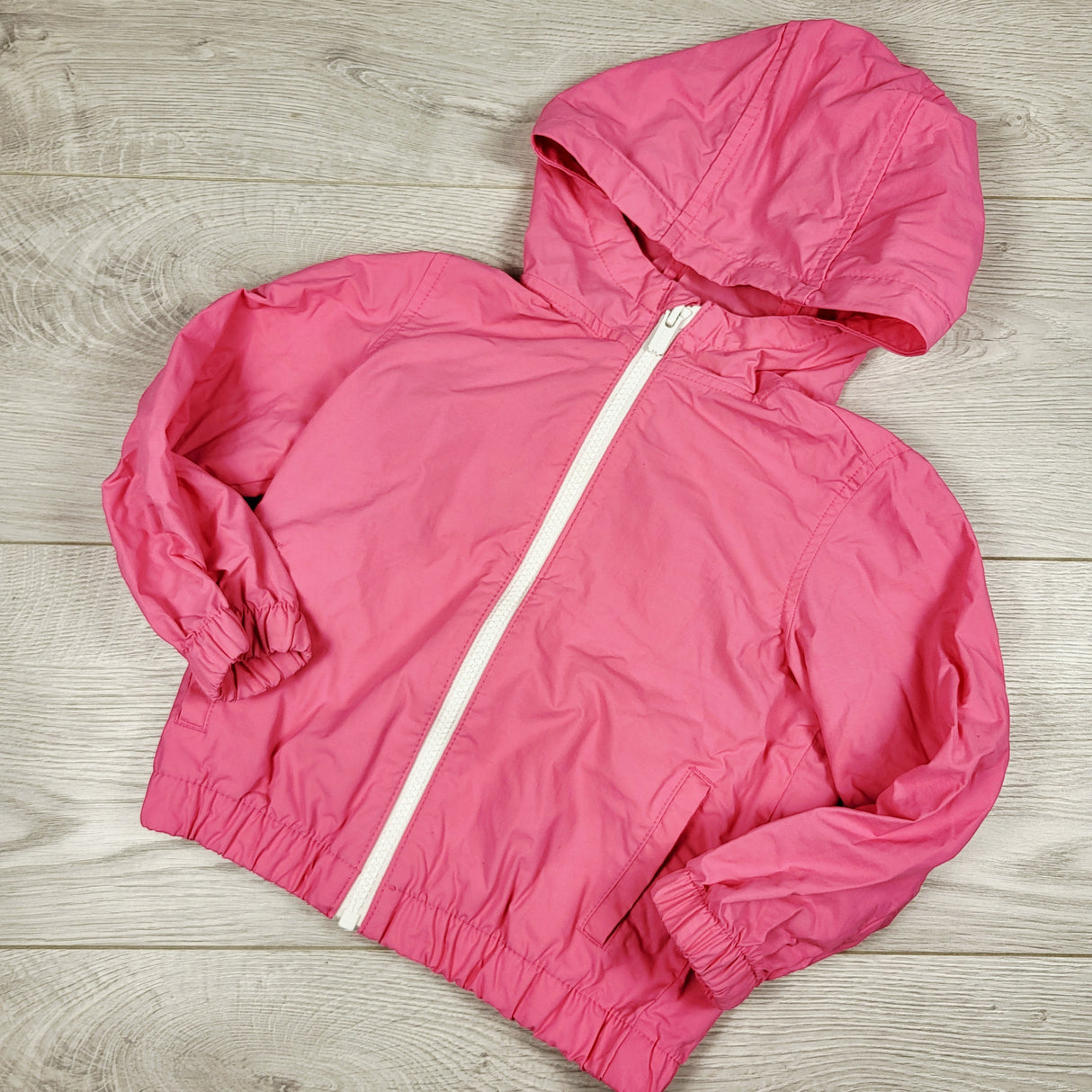 Old Navy pink waterproof hooded windbreaker style jacket. Size 2T