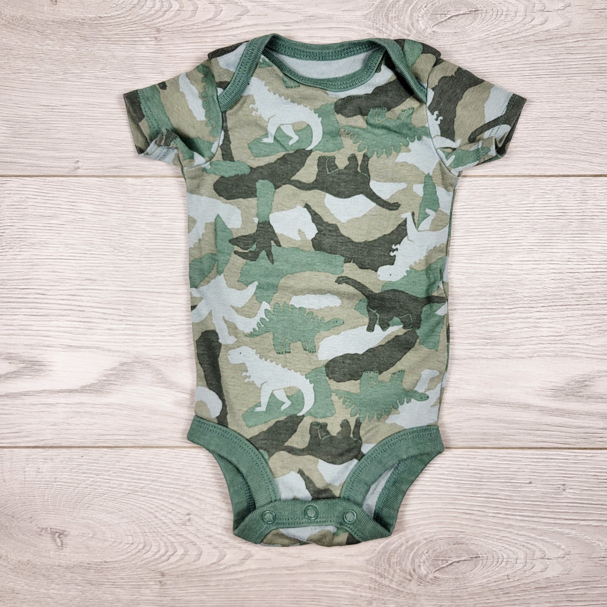 Child of Mine camouflage style bodysuit with dinosaurs. Size 0-3 months