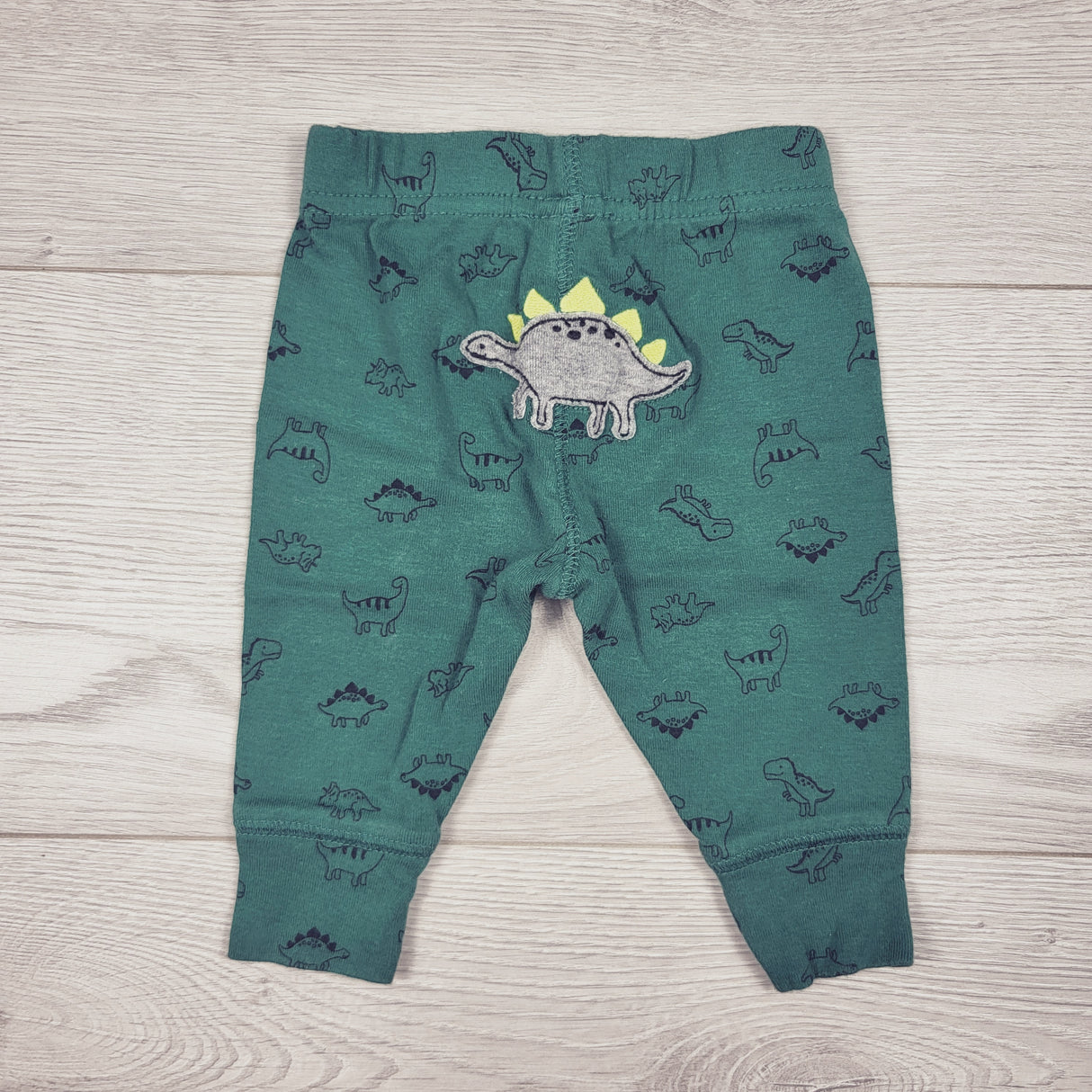 Child of Mine green dinosaur print pants. Size 0-3 months